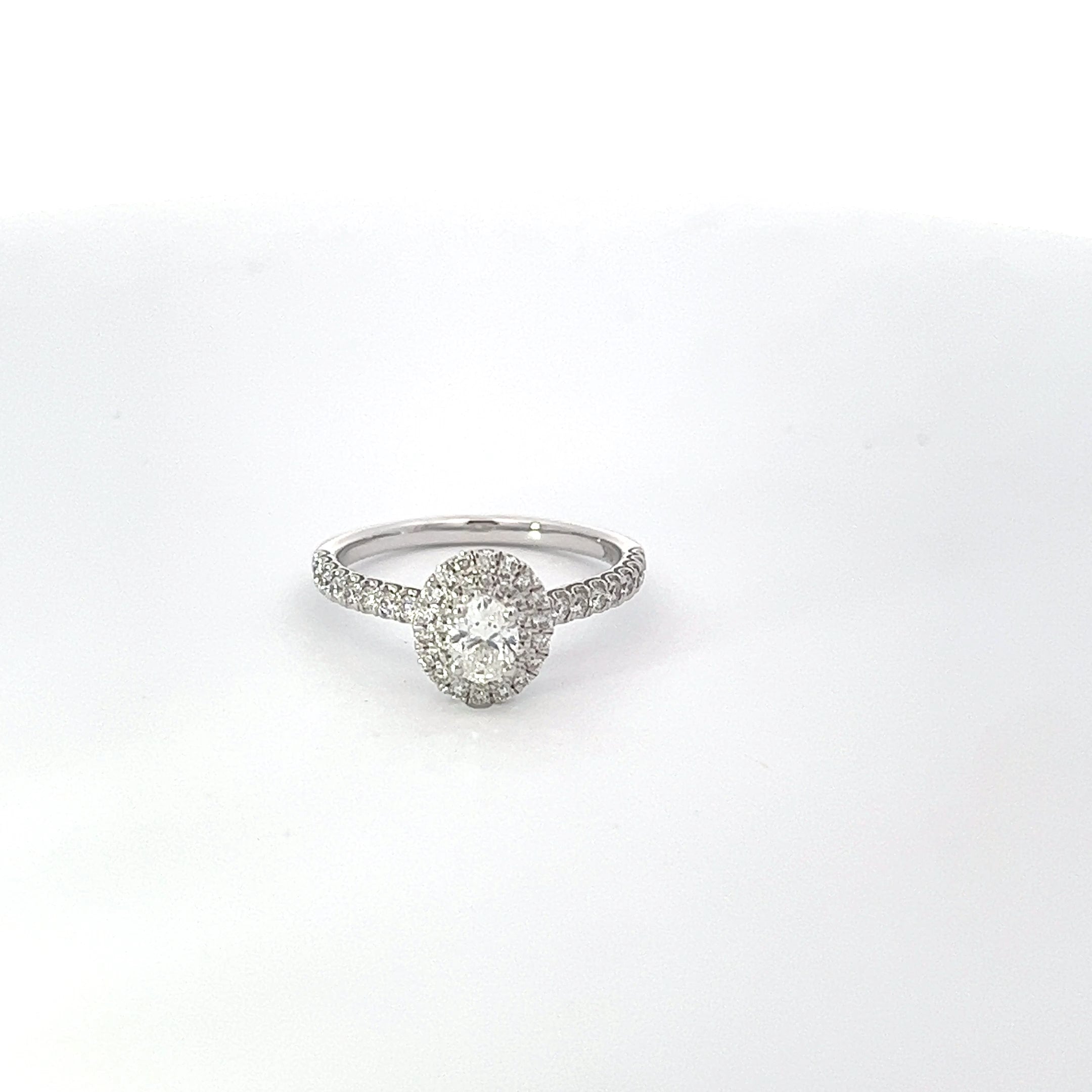 Diamond ring on a light grey background