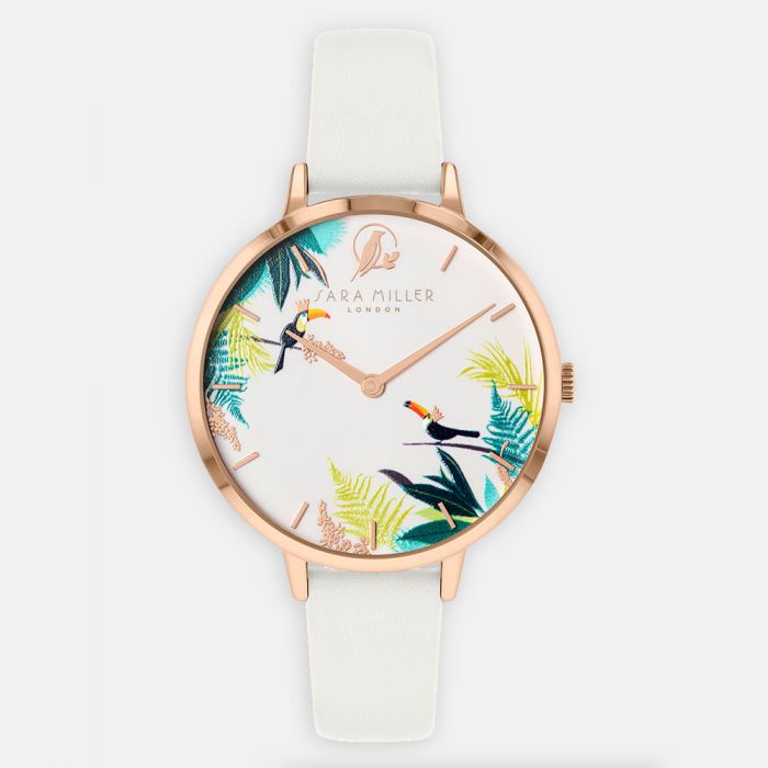 The Sara Miller TOUCAN ROSE GOLD WHITE WATCH SA2068 features a white genuine leather strap, rose gold case, and a dial with tropical toucans and foliage.