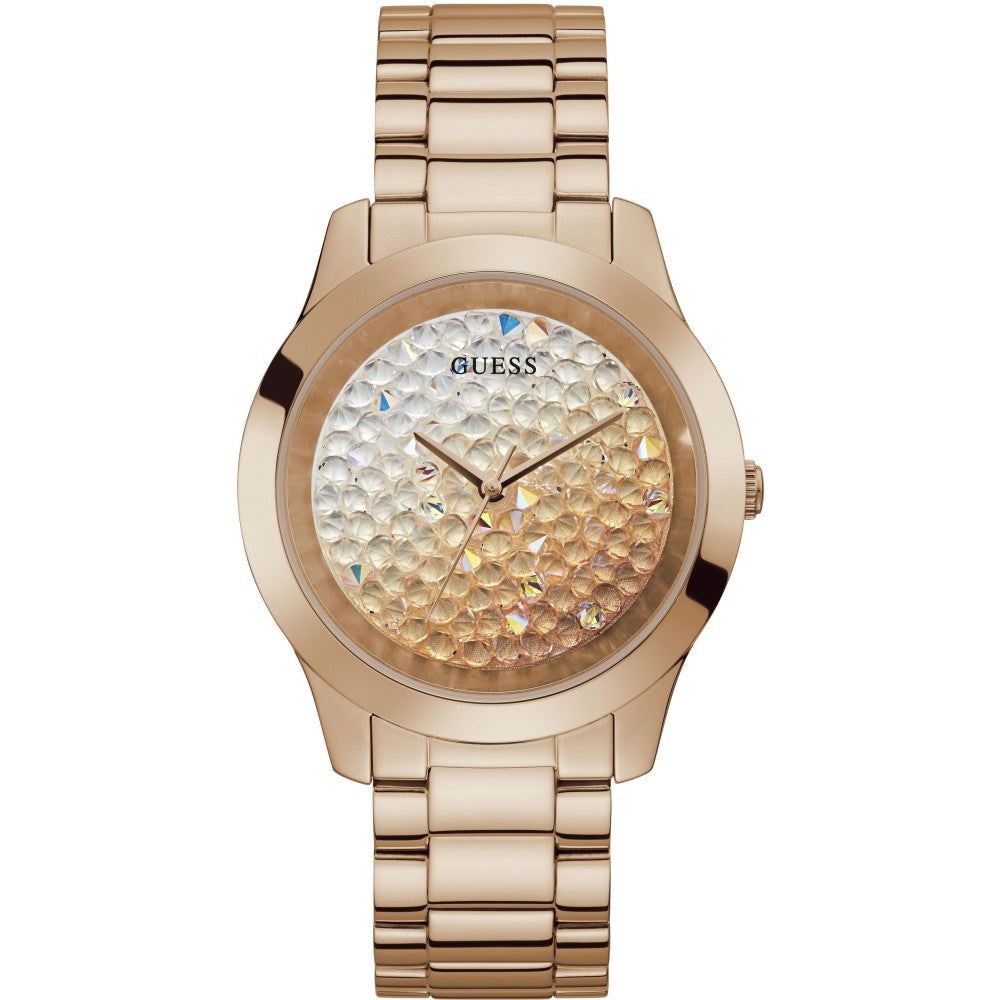 The Guess Ladies GW0020L3 Crush Watch in rose gold tone features a polished bracelet and a textured, iridescent crystal dial with gold hands, no hour markers, and the Guess logo at the top.