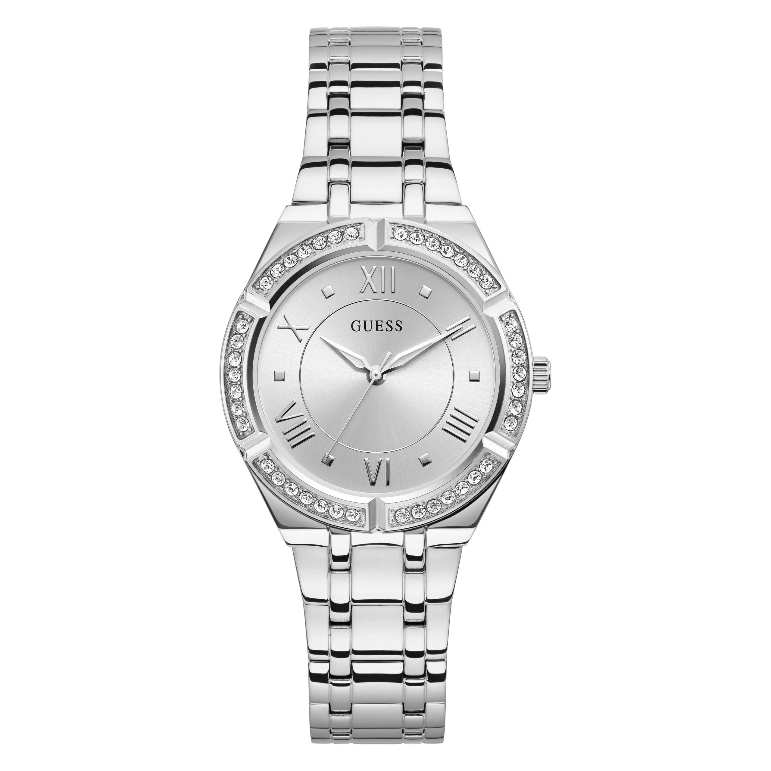 The Guess GW0033L1 Ladies Cosmo Silver Tone Watch features a round face with Roman numerals, a crystal-set bezel, and a sleek silver-tone metal link band.