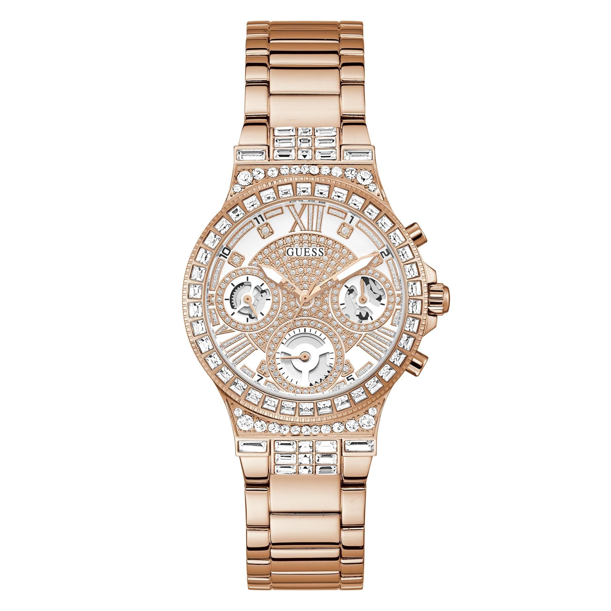 The Guess GW0320L3 Ladies Moonlight Rose Gold Tone watch features a stainless steel bracelet, crystal bezel, three subdials, and Roman numeral hour markers for an elegant touch.