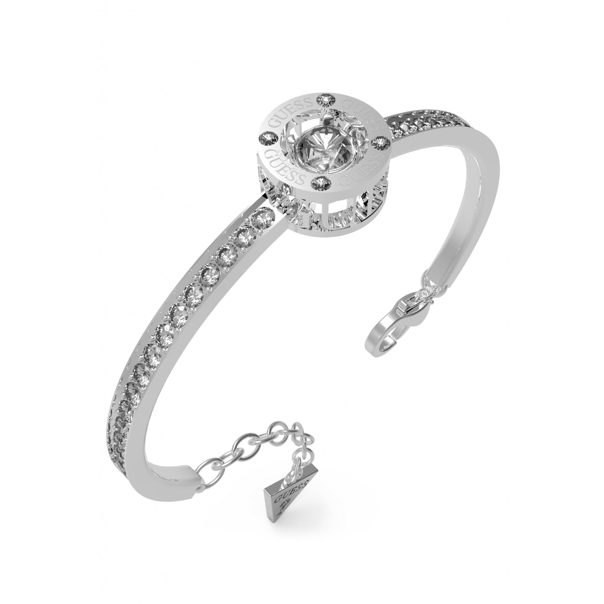 The Guess Jewellery Solitaire Silver Tone CZ Bangle UBB01460RHL features a round crystal centerpiece, sparkling crystal accents on a rhodium plated band, and a branded charm near the clasp.