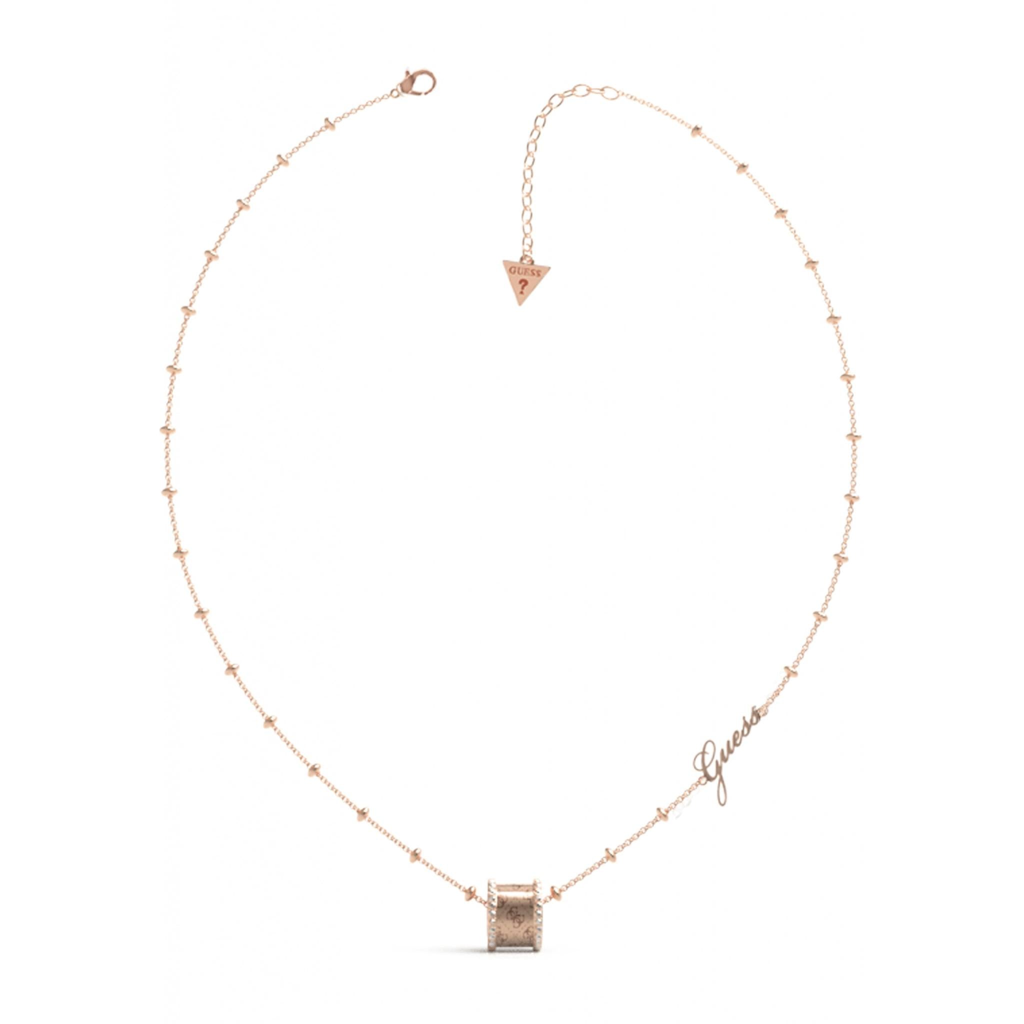 The GUESS JEWELLERY Ladies Rose Gold Tone Round Harmony Necklace (UBN01153RG) features a rose gold chain with bead accents, a round pendant engraved with "Guess," and an adjustable length finished with a signature triangle charm.