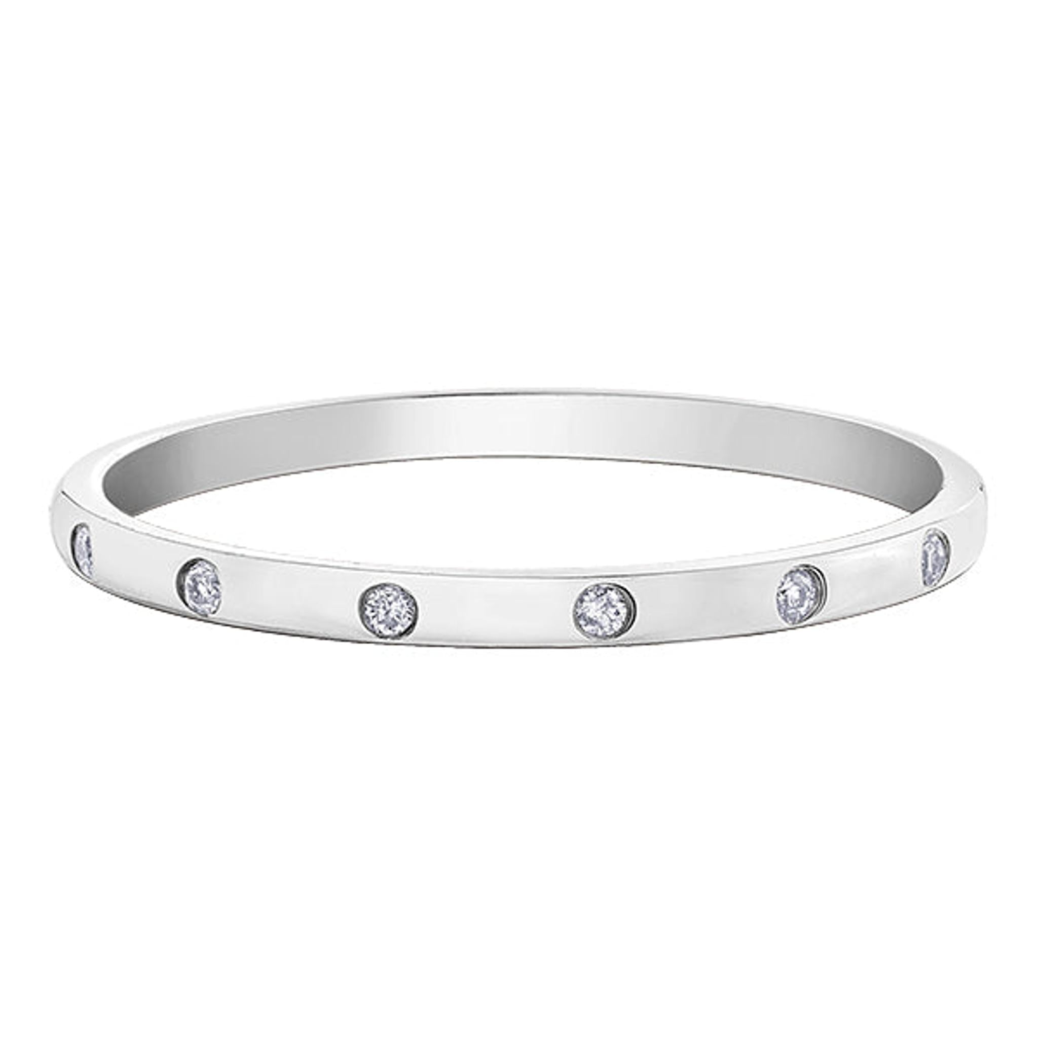 The 9ct White Gold 7 Diamond Band 0.03ct features seven brilliant cut diamonds, each evenly spaced and set into a slim white gold band for a timeless, elegant look.