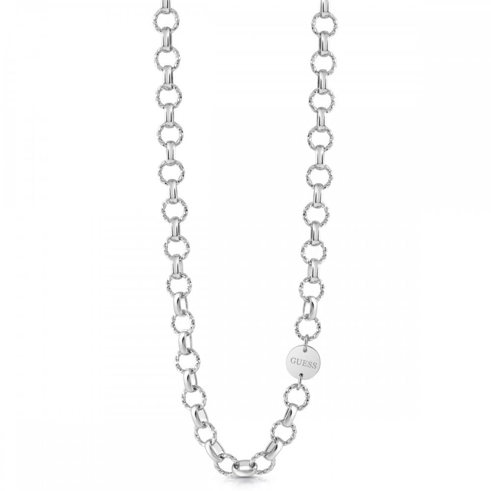The GUESS JEWELLERY UBN29044 is a silver tone chain reaction link necklace with large round links and a circular "GUESS" tag, reflecting the brand's signature elegance.