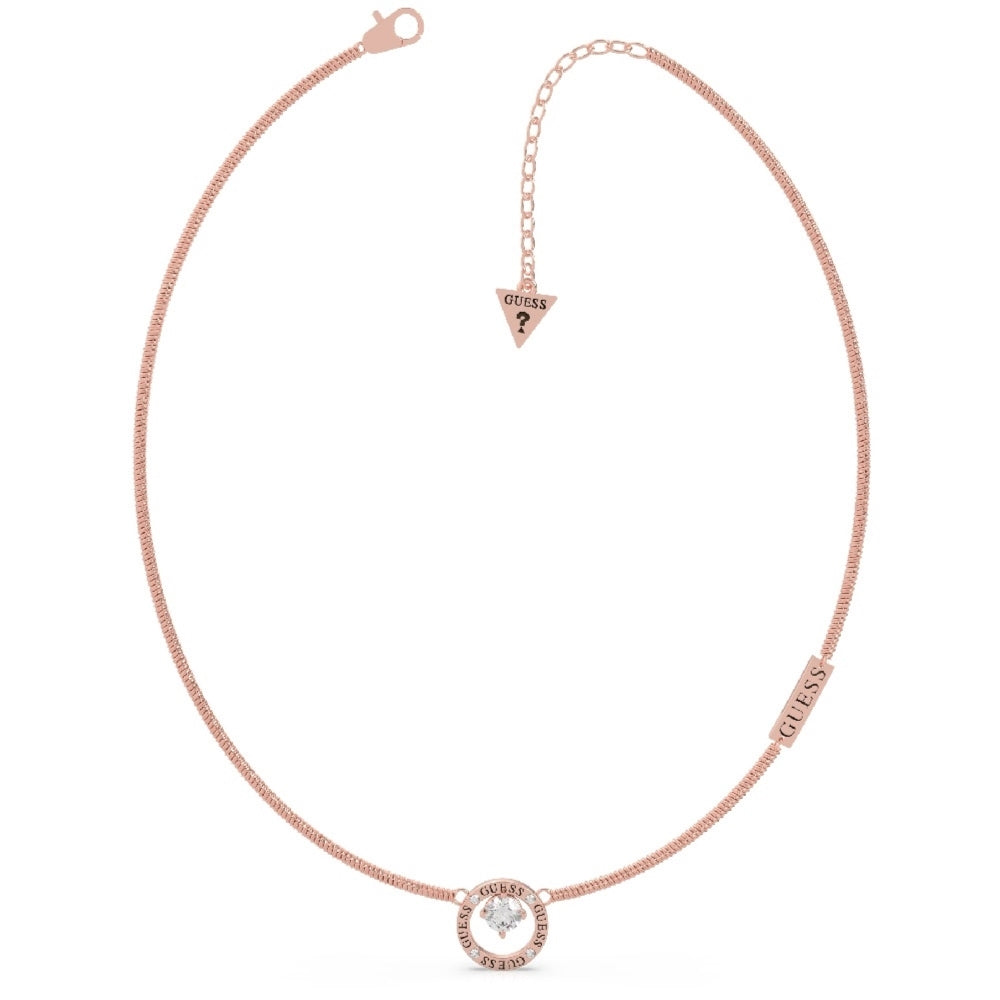 Guess UBN20123 All Around You Rose Gold Tone necklace features a Swarovski crystal circle pendant, GUESS logo tag, and an adjustable chain with a signature triangular Guess charm at the clasp.
