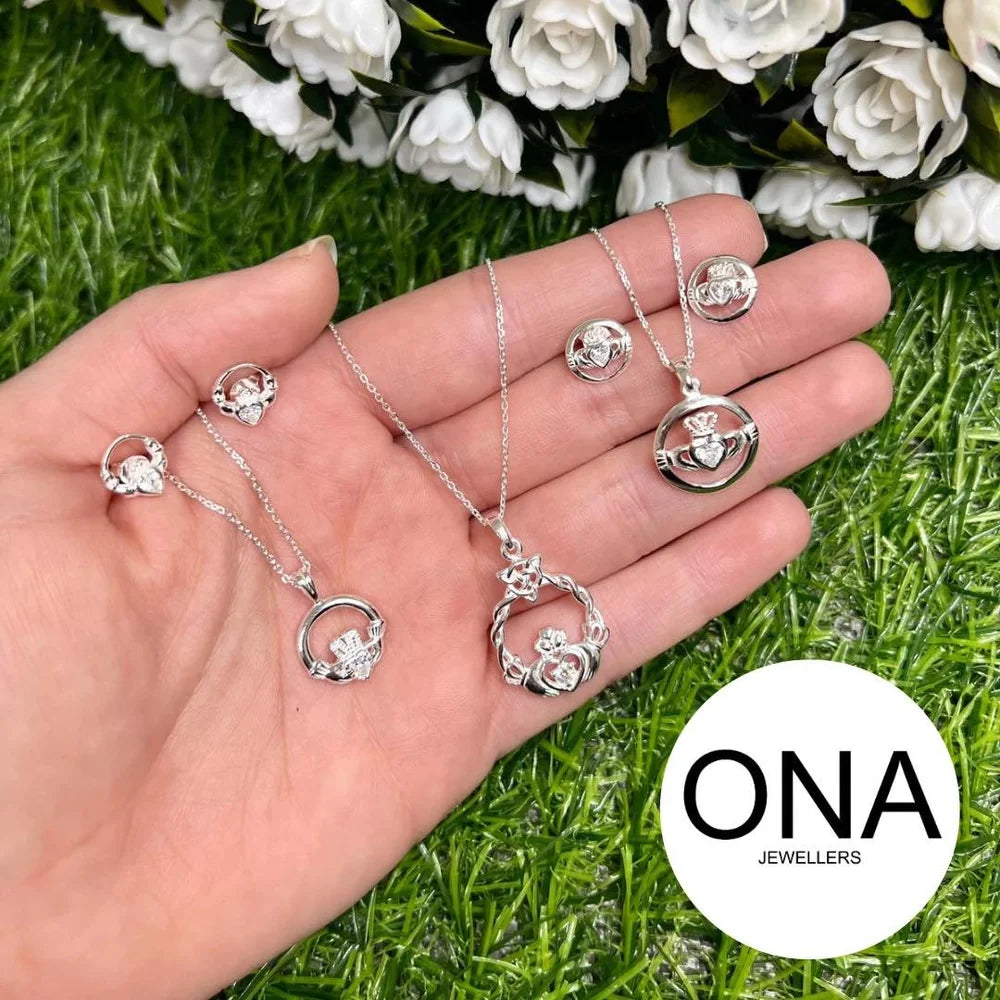 Hand holding necklaces and matching earrings with Ona Jewellers logo