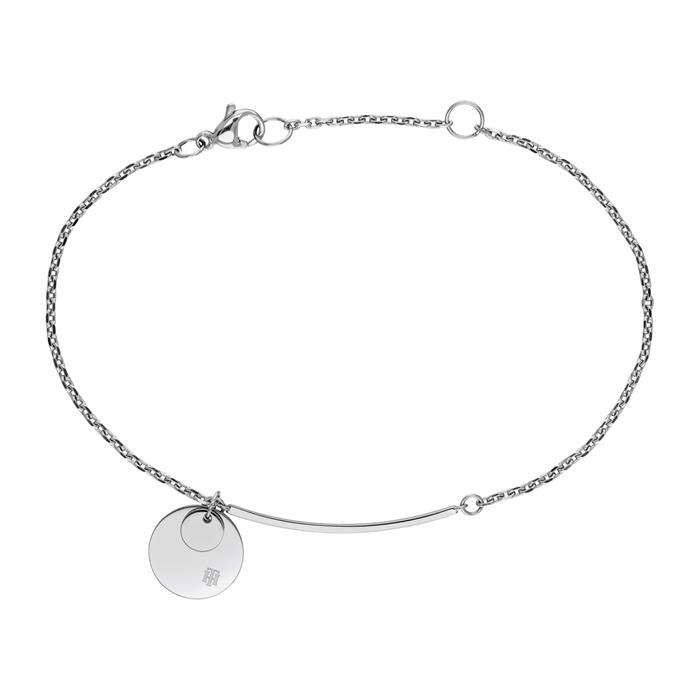 The TOMMY HILFIGER Ladies Engraveable Stainless Steel Disc Bracelet 2780261 features a silver-tone finish, round charm, curved bar, and clasp closure—perfect for personalizing or gifting to someone special.