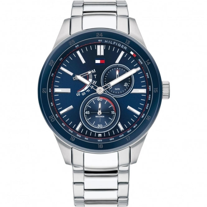 The Tommy Hilfiger 1791640 Silver Bracelet Watch Austin features a blue dial with three subdials, showing time, date, and day, plus the iconic Tommy Hilfiger logo.