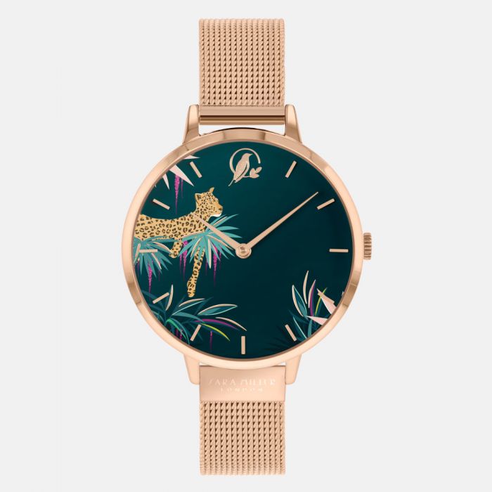 The Sara Miller Forest Green Leopard SA4062 watch features a gold mesh band and a dark green face with a leopard and leaves, complemented by simple gold hour markers and hands from the Tahiti Collection.