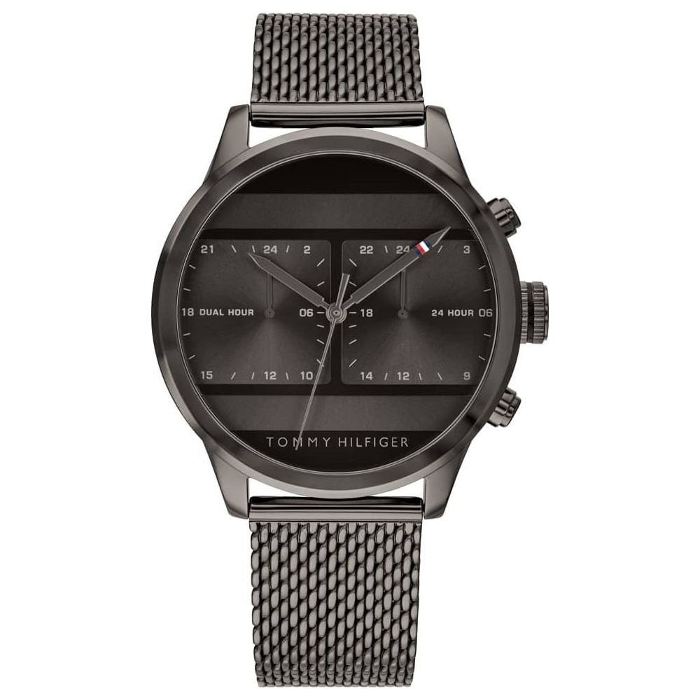 The TOMMY HILFIGER Men's Gunmetal Mesh Bracelet Watch 1791597 features a grey mesh strap, black dial, dual hour subdials, and silver-tone accents.