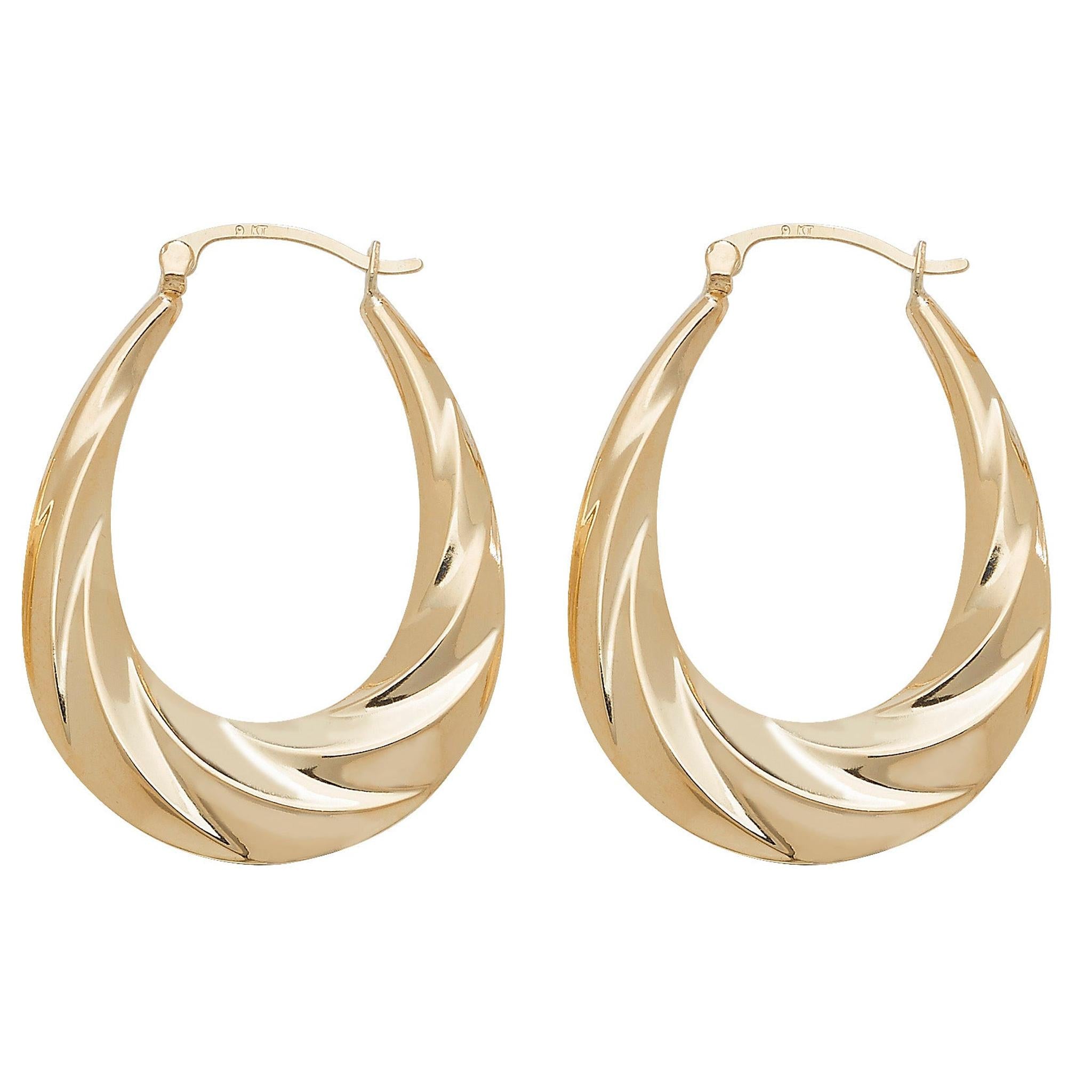 A pair of 9CT GOLD LARGE OVAL RIPPLE CREOLE EARRINGS featuring a twisted, wave-like design and latch back closures, shown on a white background.