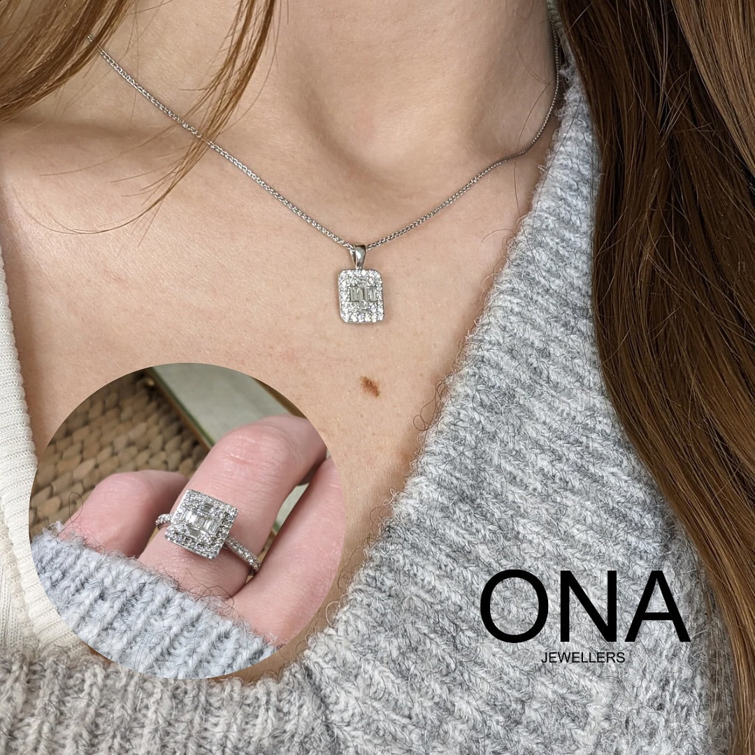 Close-up of a person wearing a rectangular diamond pendant necklace and a matching diamond ring. The logo "ONA JEWELLERS" appears in the bottom right corner.