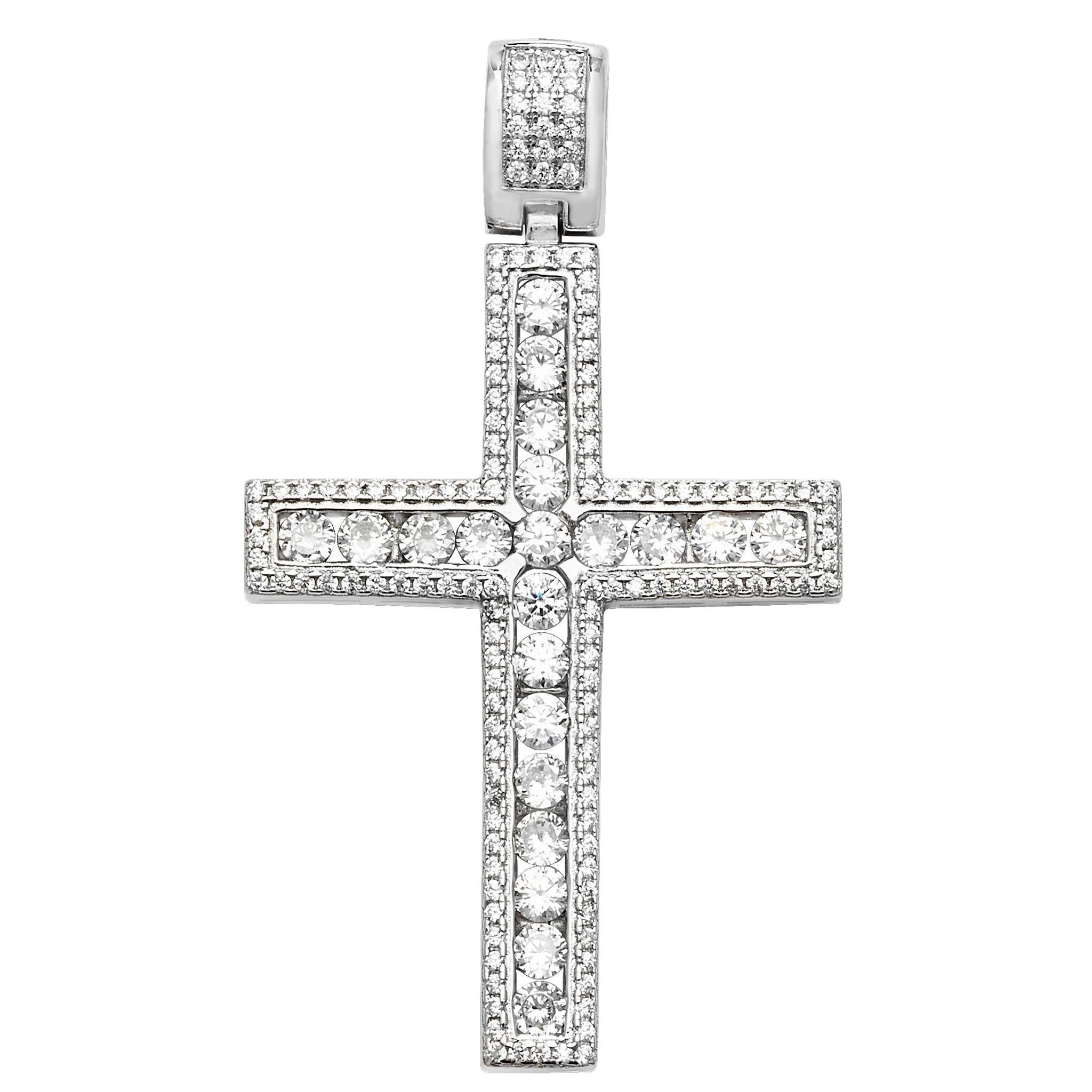 The STERLING SILVER LARGE CUBIC ZIRCONIA SET CROSS features a silver cross pendant adorned with sparkling cubic zirconia stones and a bail for easy attachment to your necklace.