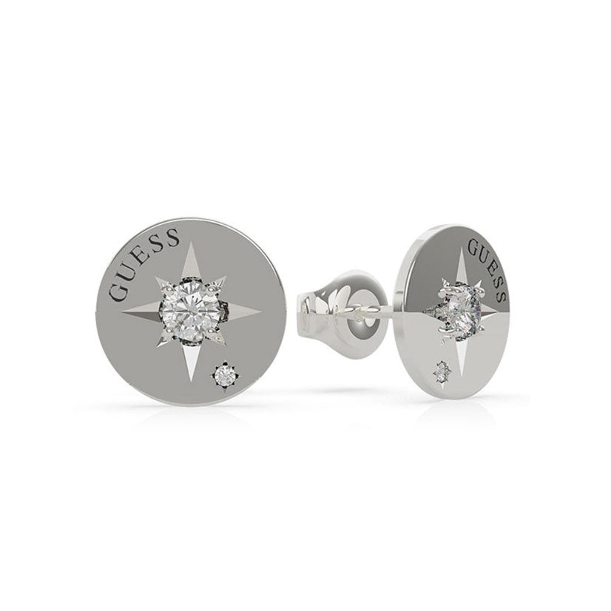 GUESS WANDERLUST UBE20017 silver-tone crystal button stud earrings feature a compass design, central clear gemstone, and "GUESS" logo.