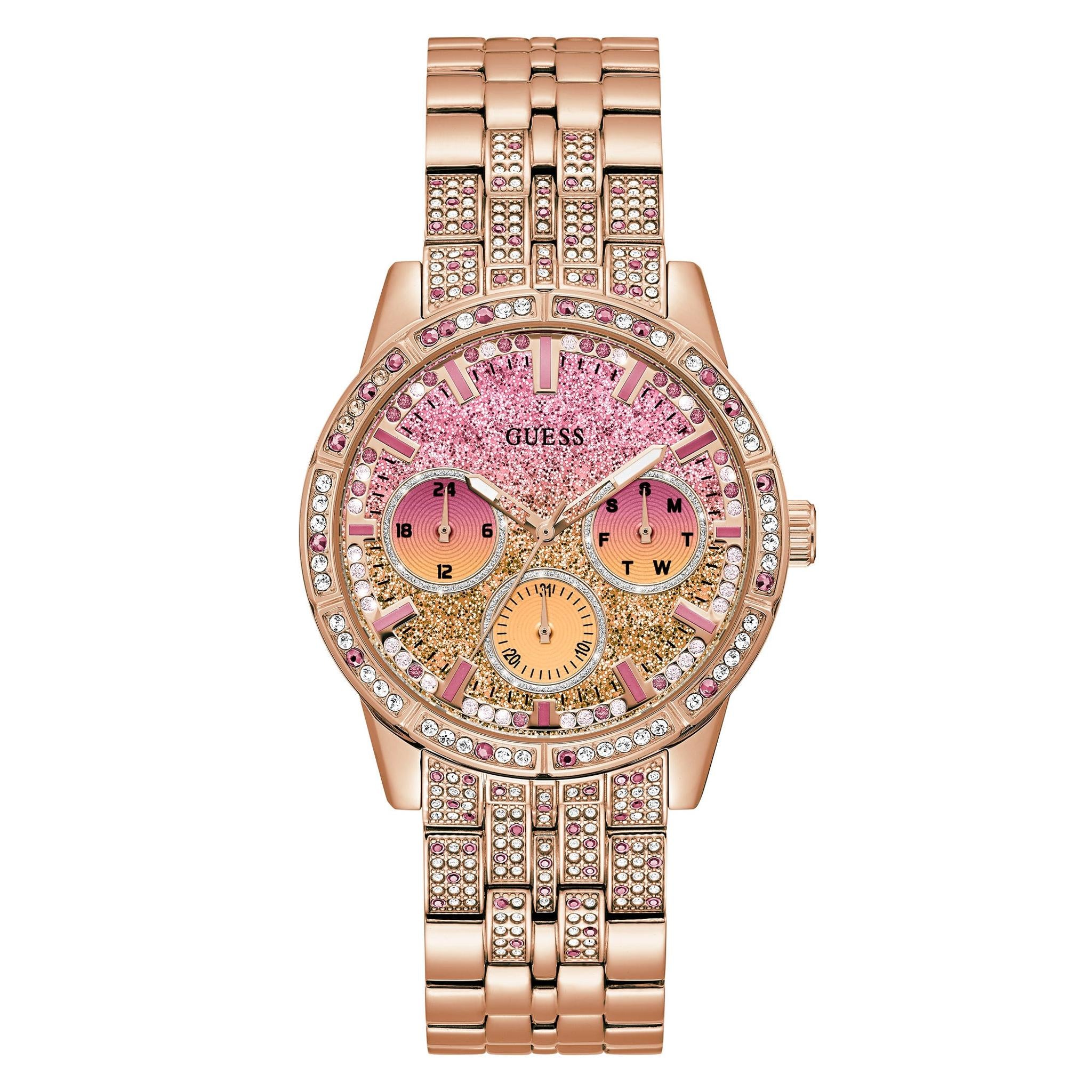 The Guess GW0365L3 Ladies Cascade Rose Gold Tone Bracelet Watch features a pink and gold glitter face, crystal bezel accents, multiple subdials, and a chic link bracelet for an elegant yet sparkling look.