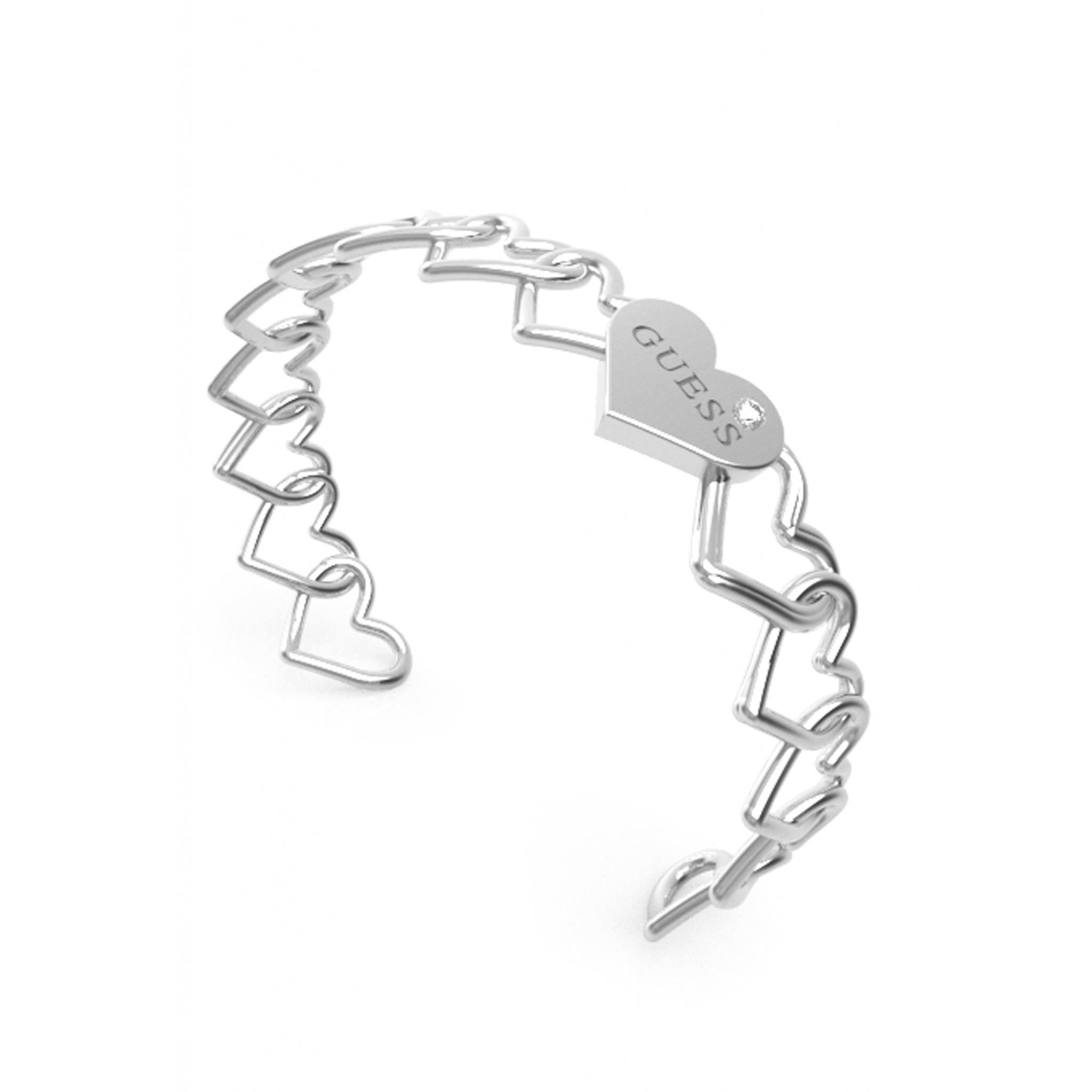 The GUESS JEWELLERY Ladies Silver Tone Heart To Heart Bangle (UBB01086RHL) features heart-shaped links and a heart charm engraved with "GUESS" and accented by a small crystal.