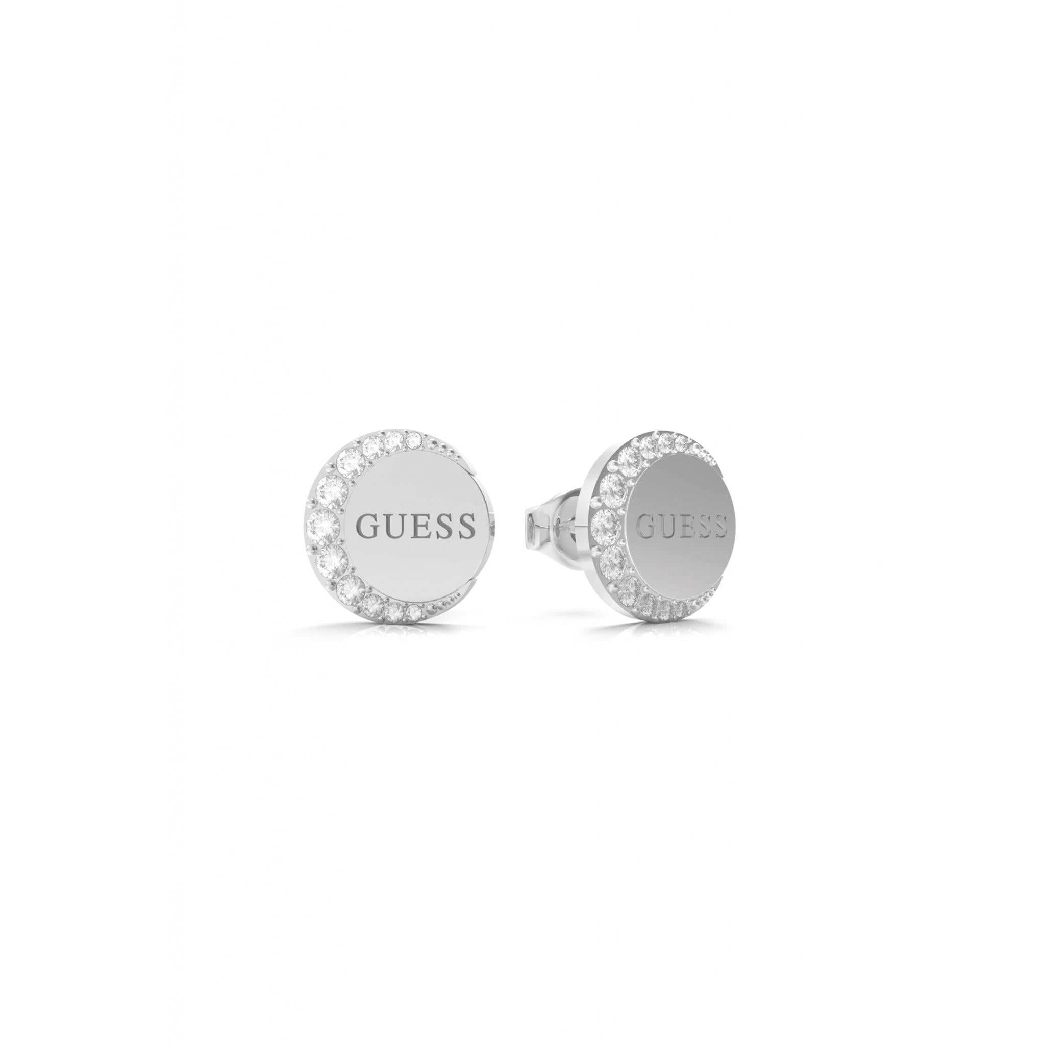 The Guess Jewellery Moon Phase Silver Tone Crystal Stud Earrings (UBE01195RH) feature round silver studs engraved with "GUESS" at the center, encircled by sparkling clear crystals.