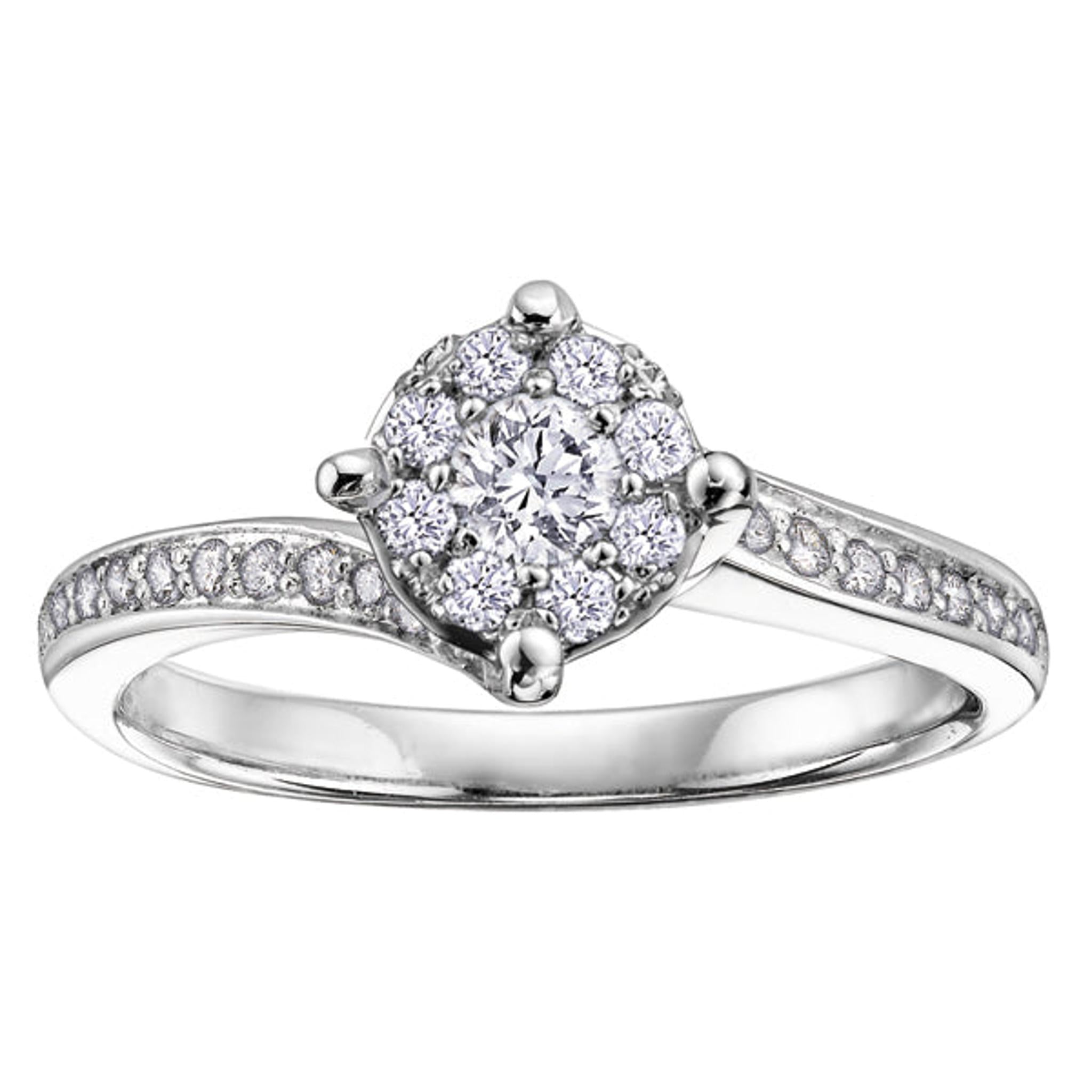 The 9ct White Gold Diamond Twist Ring 0.40ct showcases a brilliant diamond cluster at the center with sparkling stones set along its elegant twisting band for a timeless, radiant style.