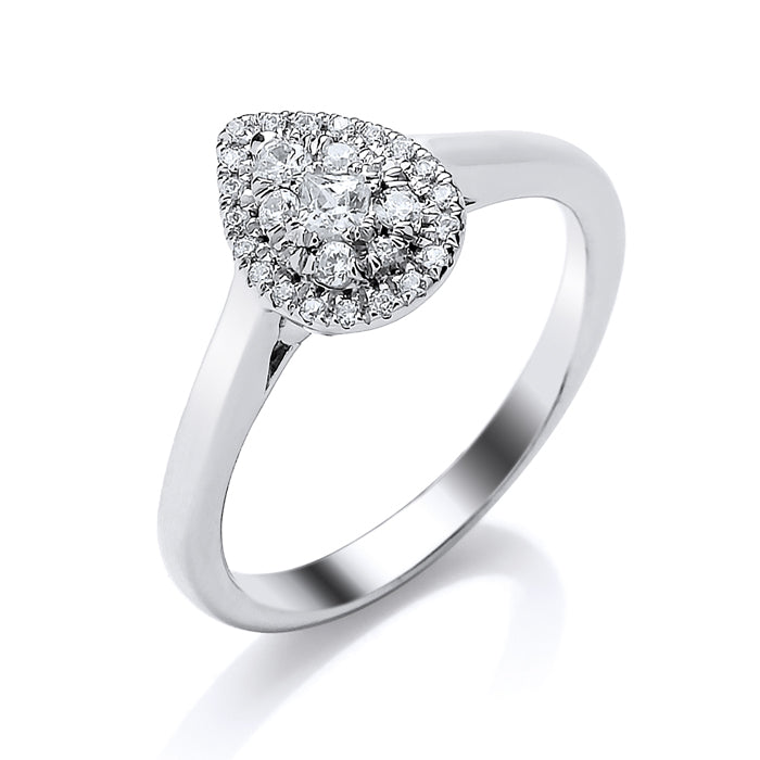 The 9ct White Gold Pear Shape Diamond Halo Ring 0.25ct features a pear-shaped cluster of round diamonds, adding elegance to any look. SGL Certified for guaranteed quality and brilliance.