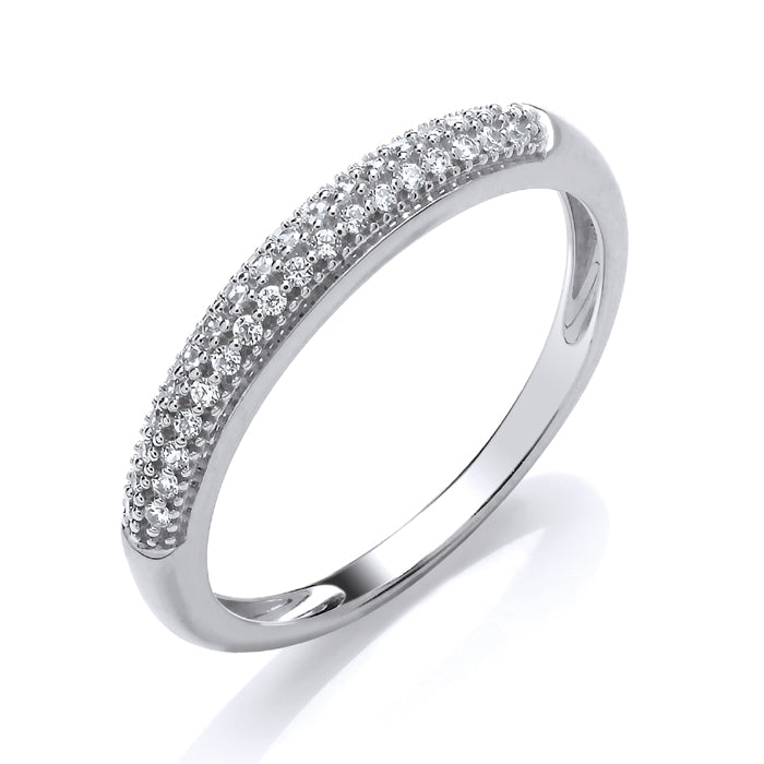 A beautiful 9ct white gold half eternity ring showcasing seven stones—diamonds and emeralds totaling 0.11ct—set on the top half of the band, displayed against a white background.
