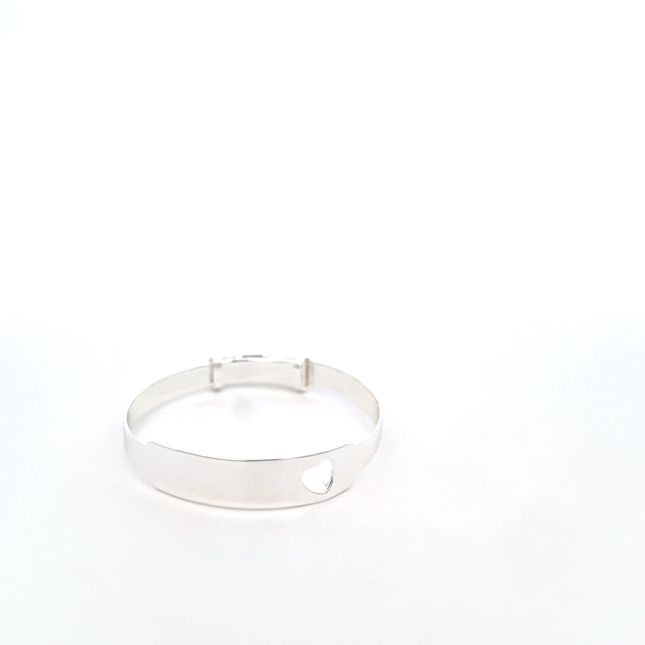 Silver bangle on a white background