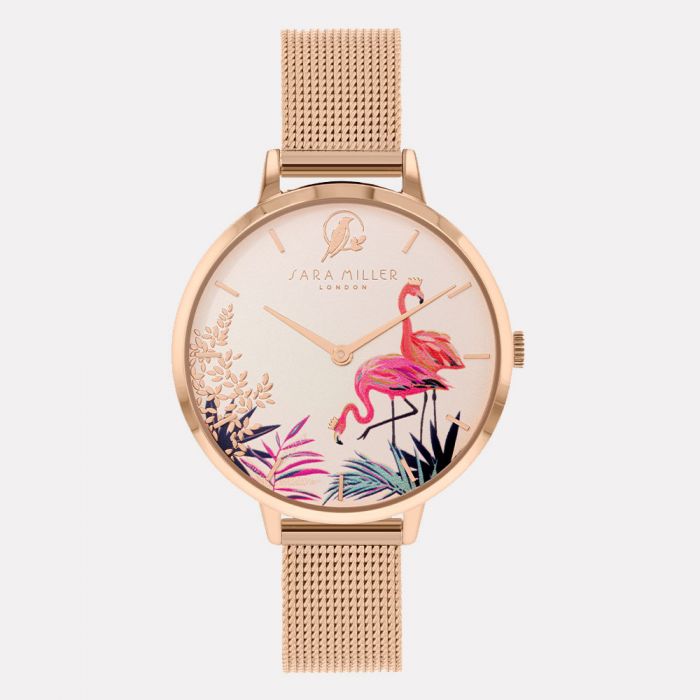 The SARA Miller Flamingo Rose Gold Mesh Watch SA4054 features two pink flamingos and tropical plants on the dial, a rose gold mesh strap, and elegant branding above the design.