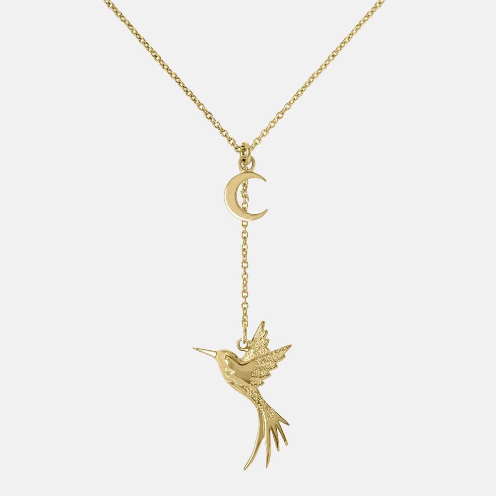 The Sara Millar Piccadilly Hummingbird And Moon Necklace SAJ2028 features a crescent moon charm above a detailed hummingbird pendant, both elegantly hanging from an 18ct gold plated chain.