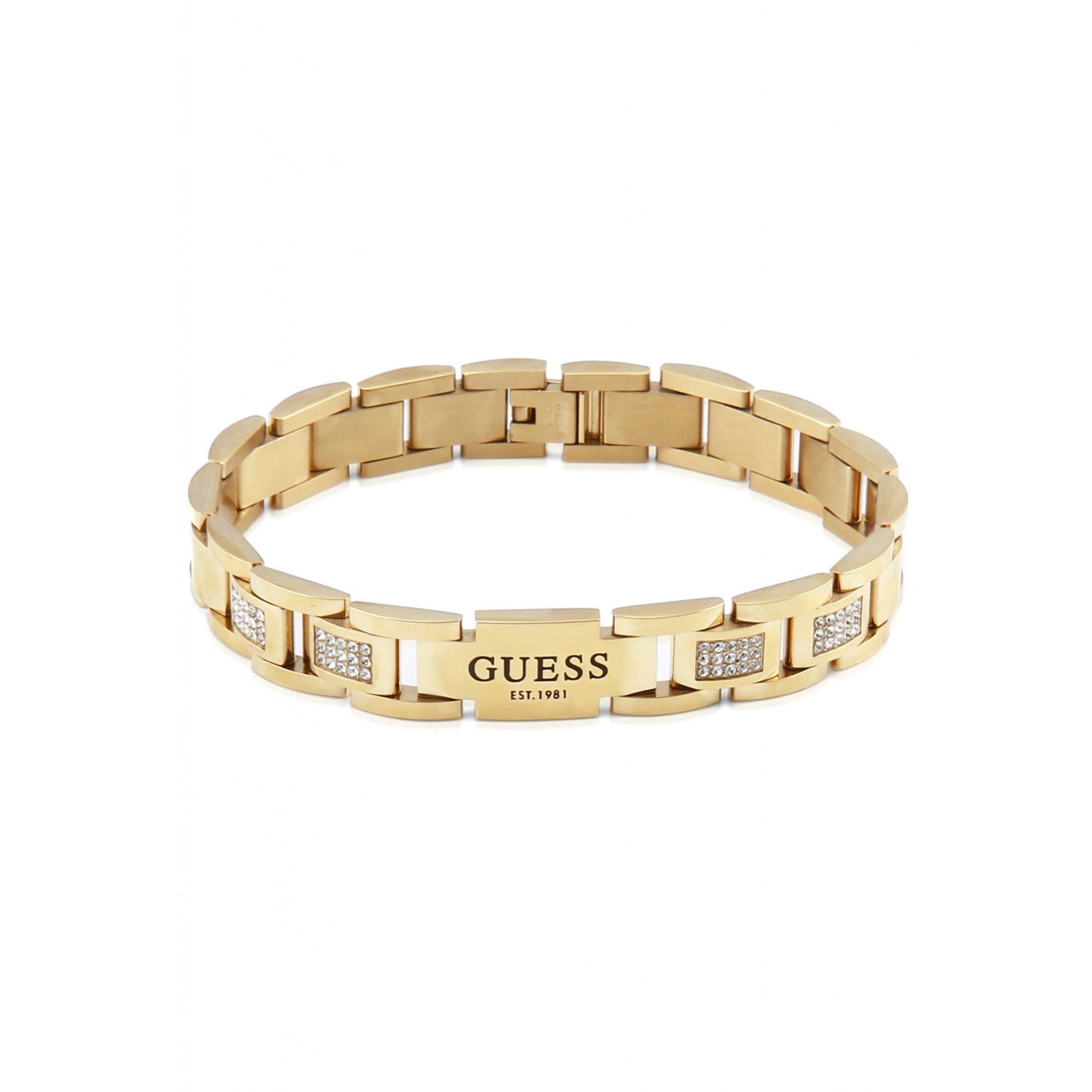 The GUESS JEWELLERY UMB01342YG Gents Frontiers Gold Tone stone set stainless steel bracelet features an engraved center plate and shimmering crystals—an elegant accessory for any occasion, shown on a white background.