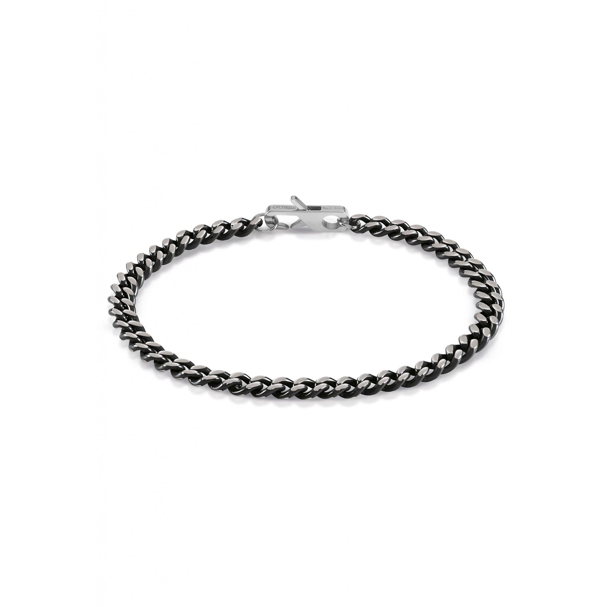 The GUESS JEWELLERY UMB01382STBKL Gents Ayia Napa Black Tone Stainless Steel Curb Bracelet features a slim, black and silver design with a simple clasp, shown against a white background.
