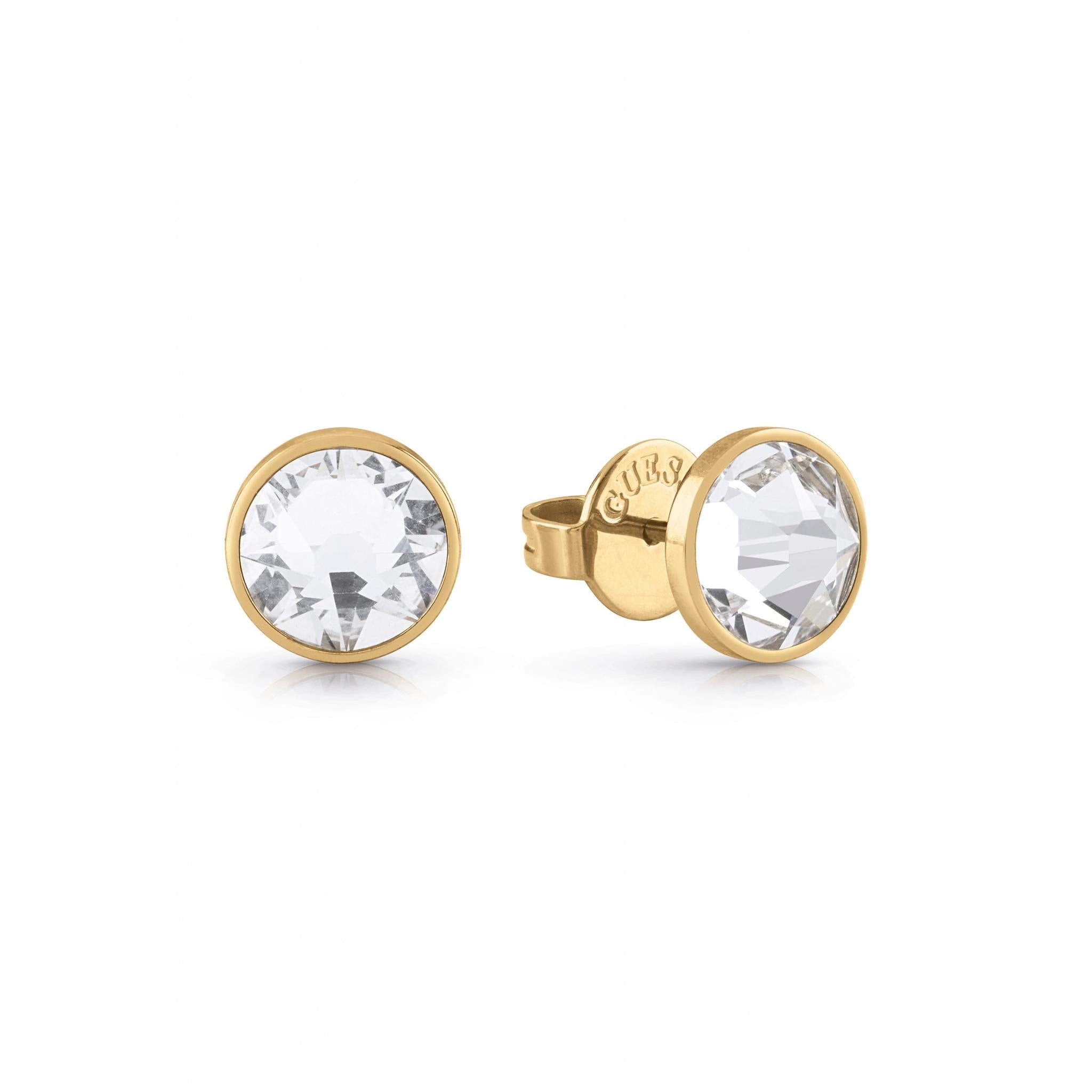 The GUESS JEWELLERY UME01343ST Gents Frontiers Gold Tone Round Crystal Stud Earrings feature a gold setting with push-back clasps, perfect for men and beautifully displayed on a white background.