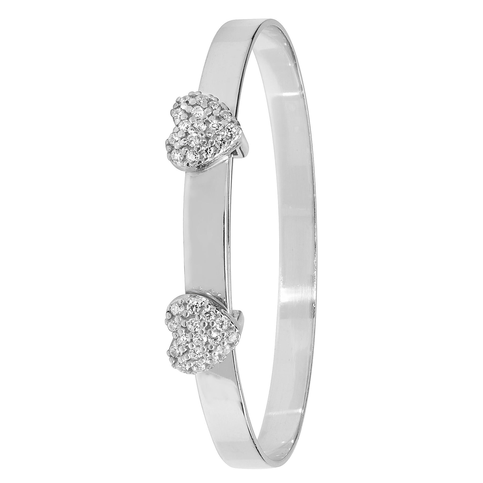 The STERLING SILVER BABY BANGLE EXPANDABLE CZ HEARTS features two heart-shaped accents with clear CZ stones facing each other, creating an elegant and adjustable design perfect as a baby’s bangle.