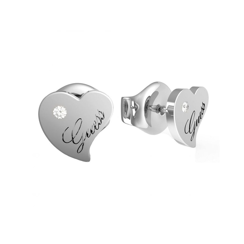 The Guess Queen of Hearts Stud Earrings UBE79015 feature silver heart-shaped studs engraved with "Guess" and a small round gemstone accent—ideal for fans of sparkling, statement Queen of Hearts earrings.