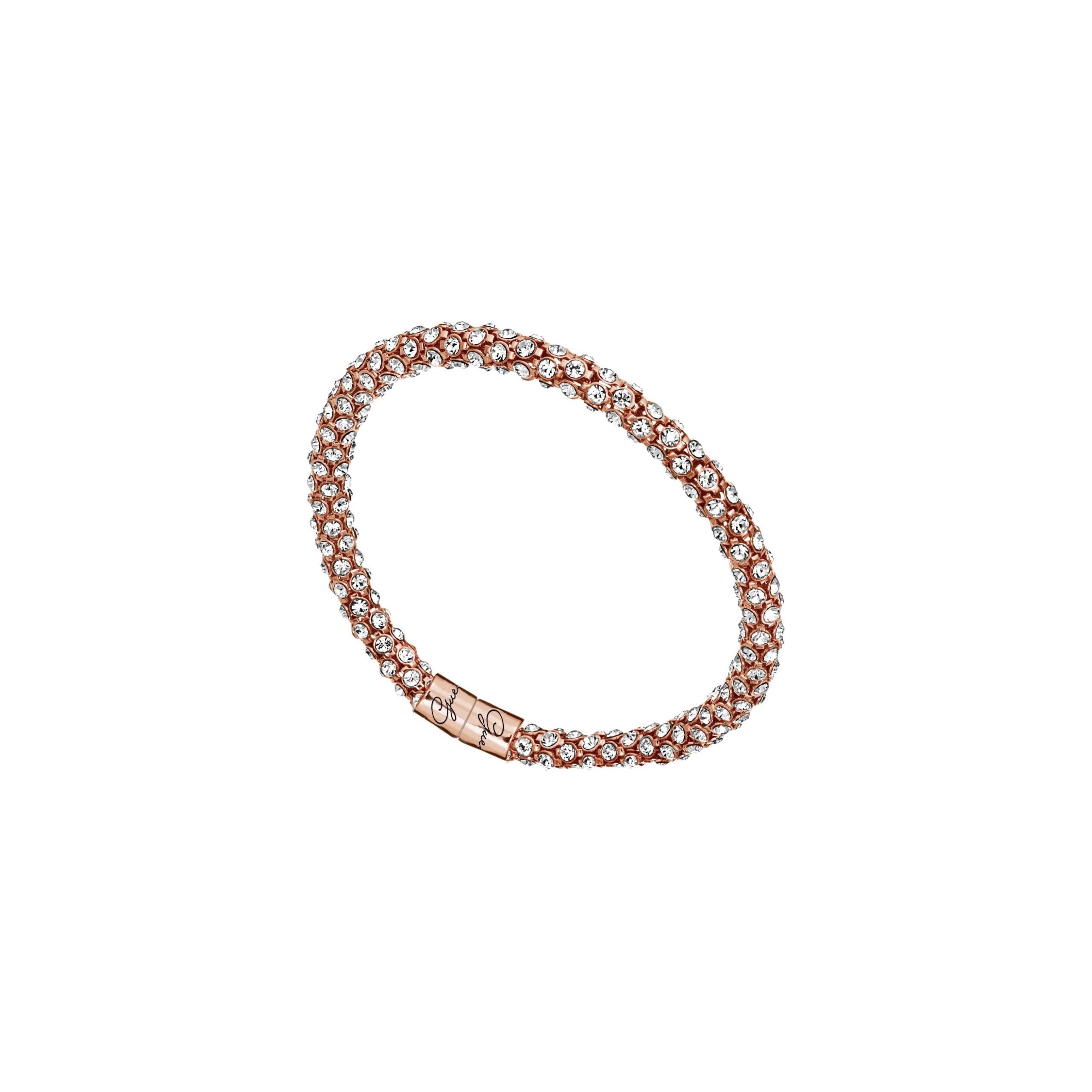 The Guess UBB81334 Ladies Rose Gold Tone Glamazon Bracelet features intertwined rows of small round crystals and a clasp engraved with a decorative design.