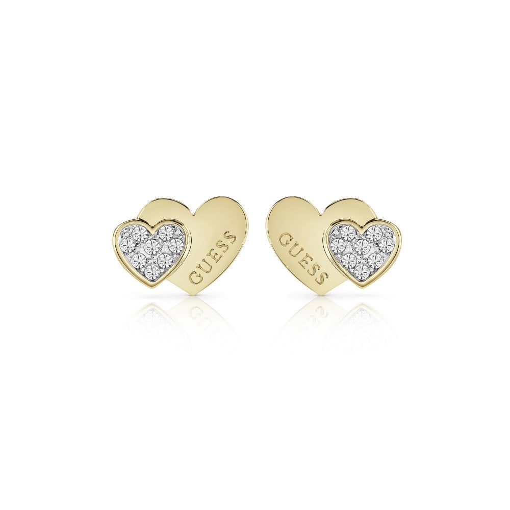 The Guess Me And You Gold Heart Stud Earrings (UBE84119A) feature a rose gold heart engraved with "GUESS" and an overlapping smaller crystal-studded heart for extra sparkle.