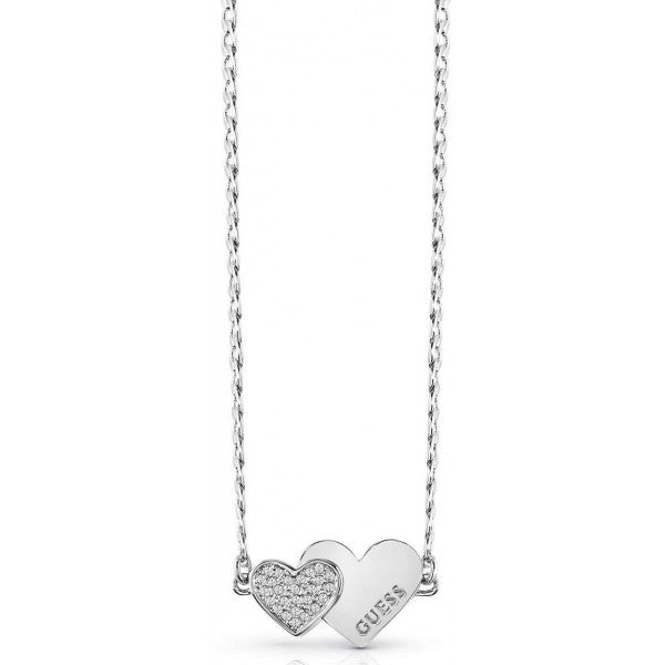 The Guess UBN84074A Me & You Necklace features two heart-shaped pendants—one with Swarovski crystals and the other engraved with "GUESS"—crafted from rhodium-plated stainless steel for lasting shine.