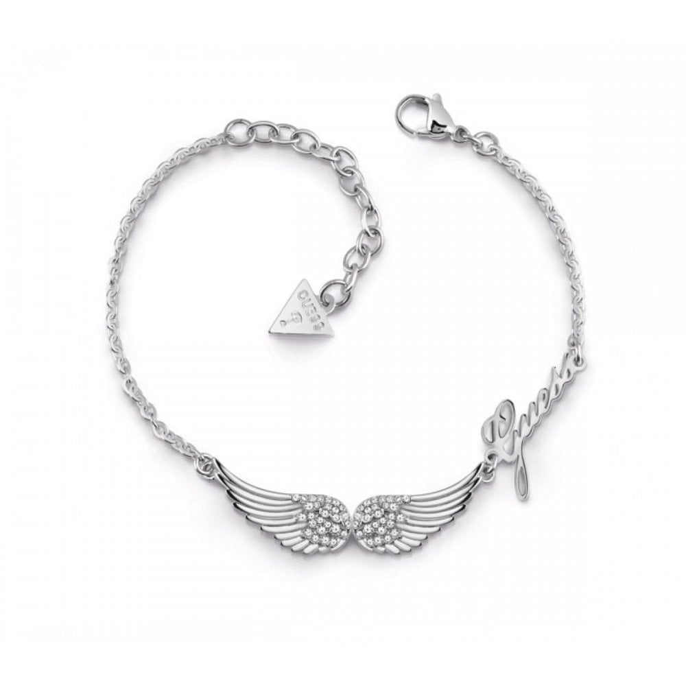 The Guess Jewellery Fly With Me Women's Silver Wing Bracelet (UBB29083-L) features angel wings, Swarovski crystals, a "Guess" logo charm, triangular tag, and secure lobster clasp—all crafted in stainless steel for lasting elegance.