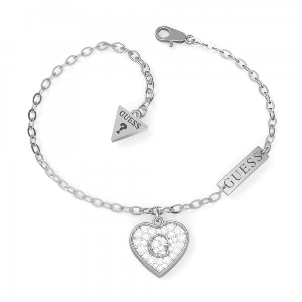 The Guess G Shine Silver Tone Crystal Heart Bracelet (UBB79062-L) features a sparkling heart pendant with a central "G," signature brand tags, and a secure lobster clasp.