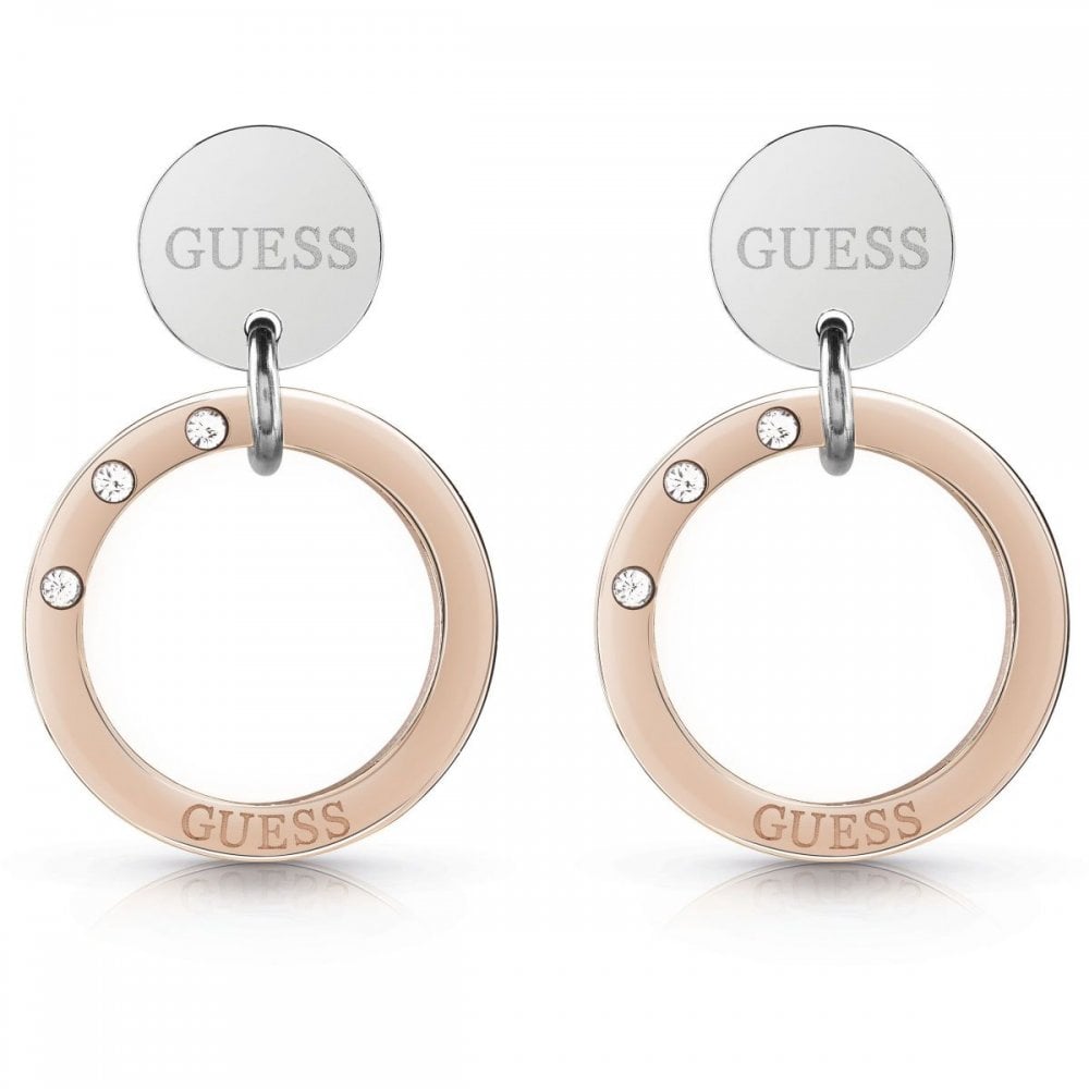 The GUESS JEWELLERY UBE29033 Rose Gold & Silver Tone Eternal Circles Earrings feature rose gold rings, three sparkling Swarovski crystals per earring, and silver discs engraved with the GUESS logo.