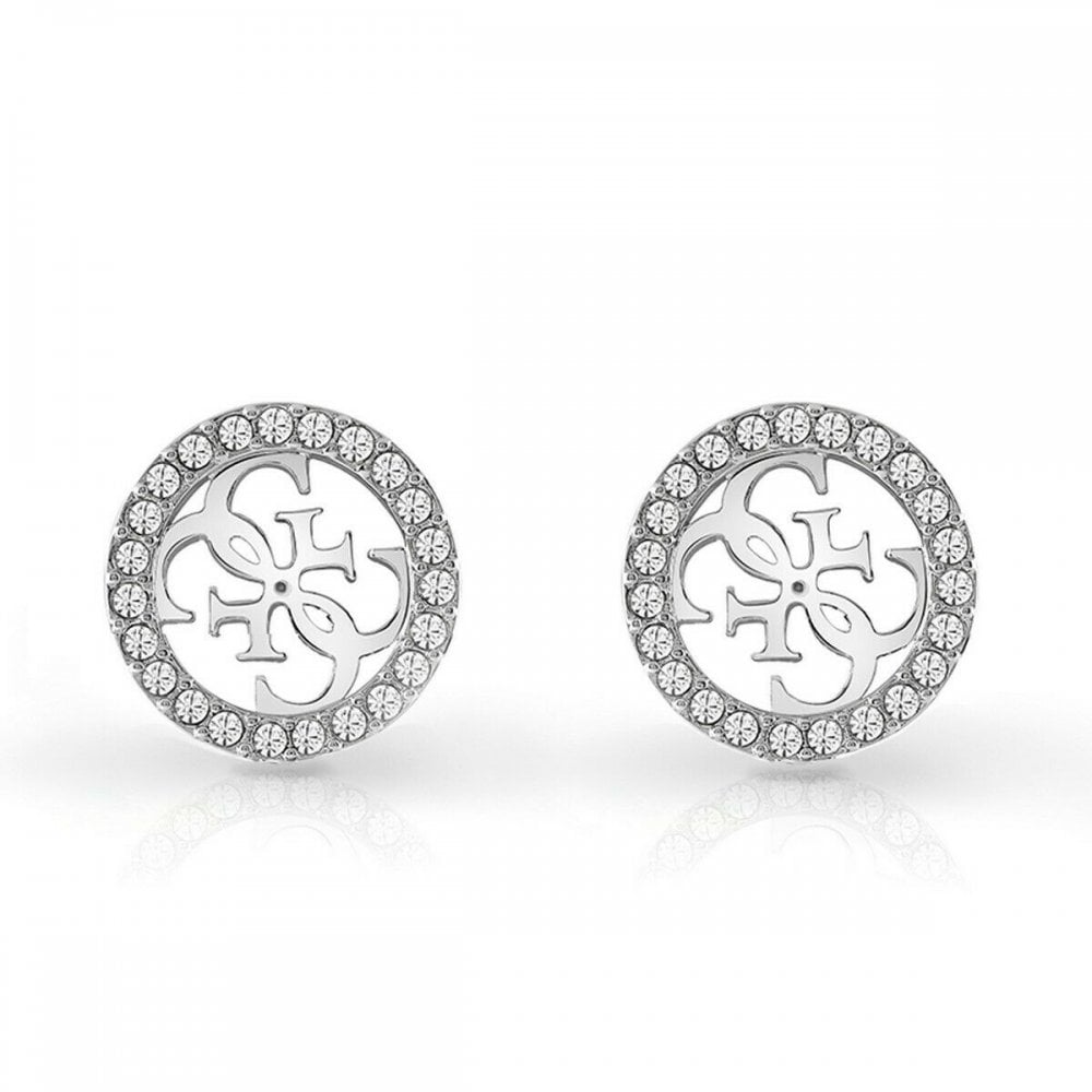 The GUESS JEWELLERY TROPICAL SUN Silver Tone Pave 4G Logo Studs (UBE78004) are round silver-tone earrings with a cut-out 4G logo design and a border of sparkling clear crystals.