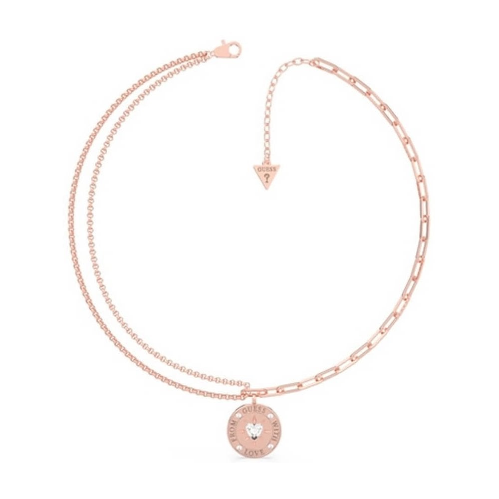 The GUESS JEWELLERY Ladies With Love Rose Gold Tone Double Chain Necklace UBB70002 features dual chains, a round "GUESS" and "LOVE" engraved pendant with a heart-shaped crystal, an adjustable clasp, and the signature triangle tag.