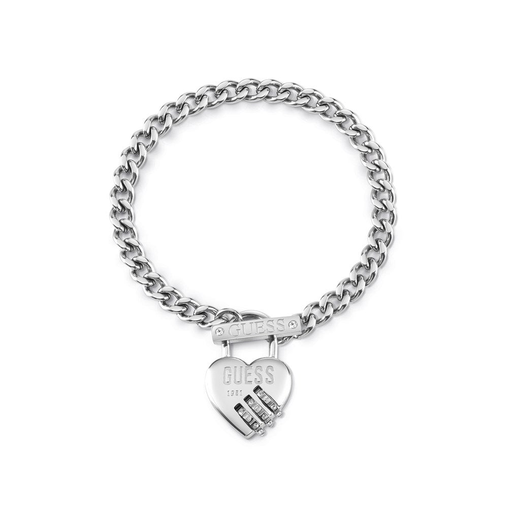 The GUESS JEWELLERY LOCK ME UP PADLOCK HEART BRACELET UBB20056-L features a silver chain, heart-shaped padlock charm with the GUESS logo, and Swarovski crystals—a beautiful piece of designer jewellery.