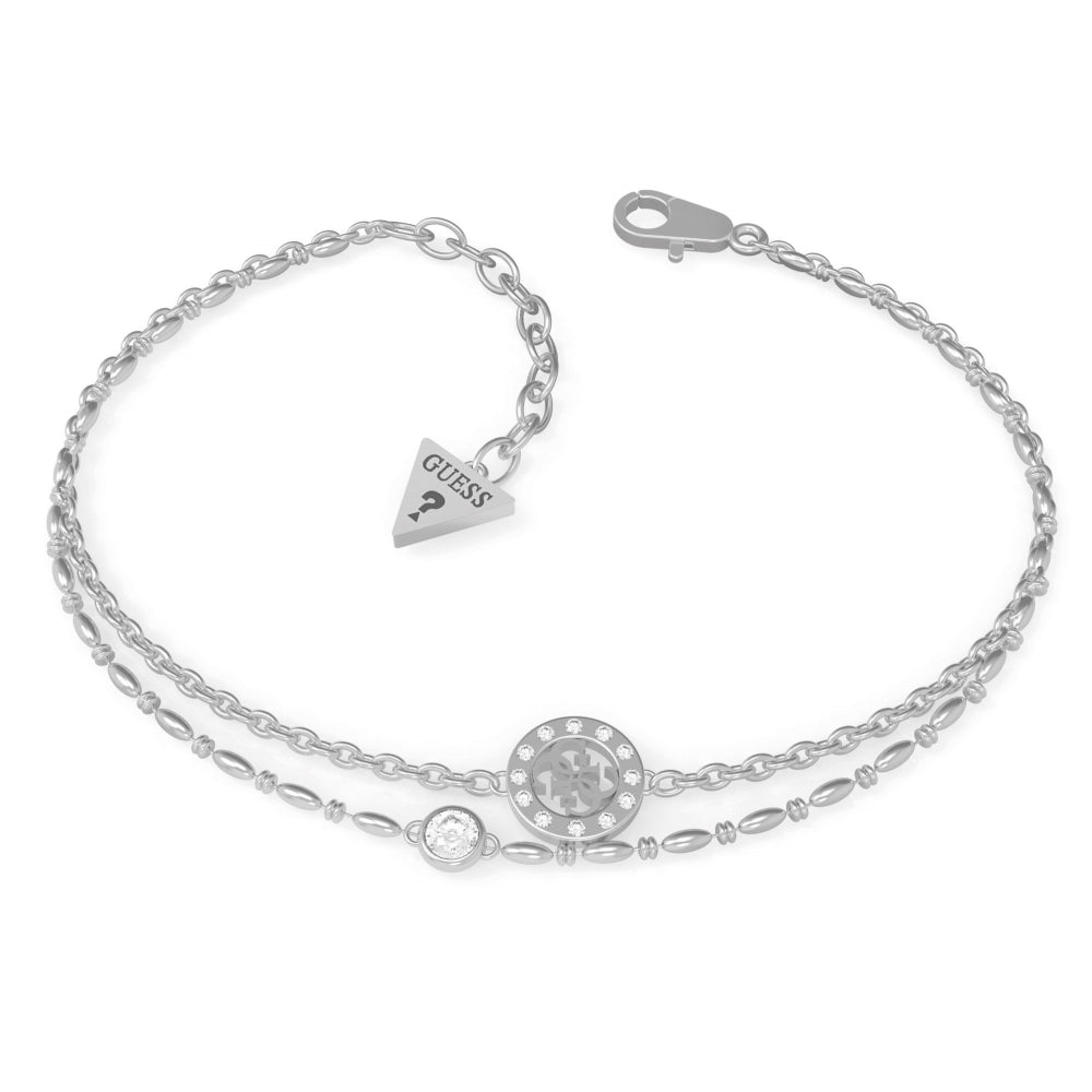 The Guess UBB79032-L Women's Silver Tone Miniature is a double-row silver bracelet featuring a round Swarovski crystal charm, a smaller accent crystal, and a signature triangular GUESS logo tag.
