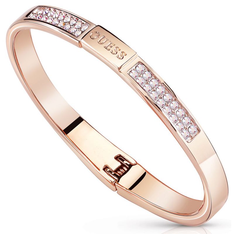 The Guess PVD Colours Rose Gold Crystal Bangle UBB84086-S features sparkling crystals and a hinged clasp, crafted with elegant rose gold PVD for a chic, modern look.