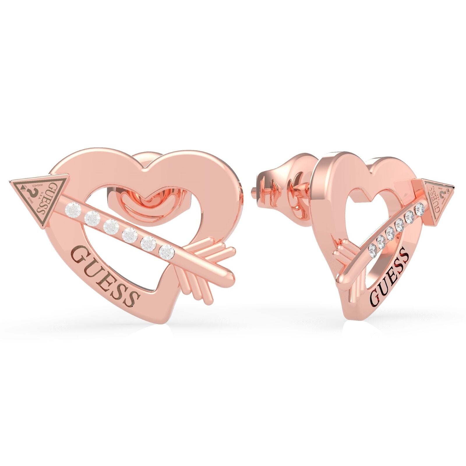 The Guess UBE79123 Women's Rose Gold Tone Across My Heart Stud Earrings showcase a heart and arrow design with sparkling Swarovski crystals and the "GUESS" logo engraved on each piece.