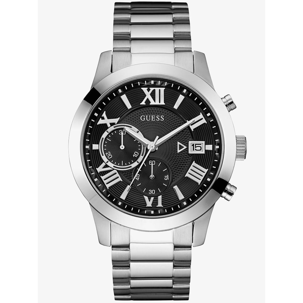 The Guess Mens Atlas W0668G3 Silver Tone Bracelet Watch features a stainless steel case, black dial with Roman numerals, three subdials, a date window, and a sleek metal link band.