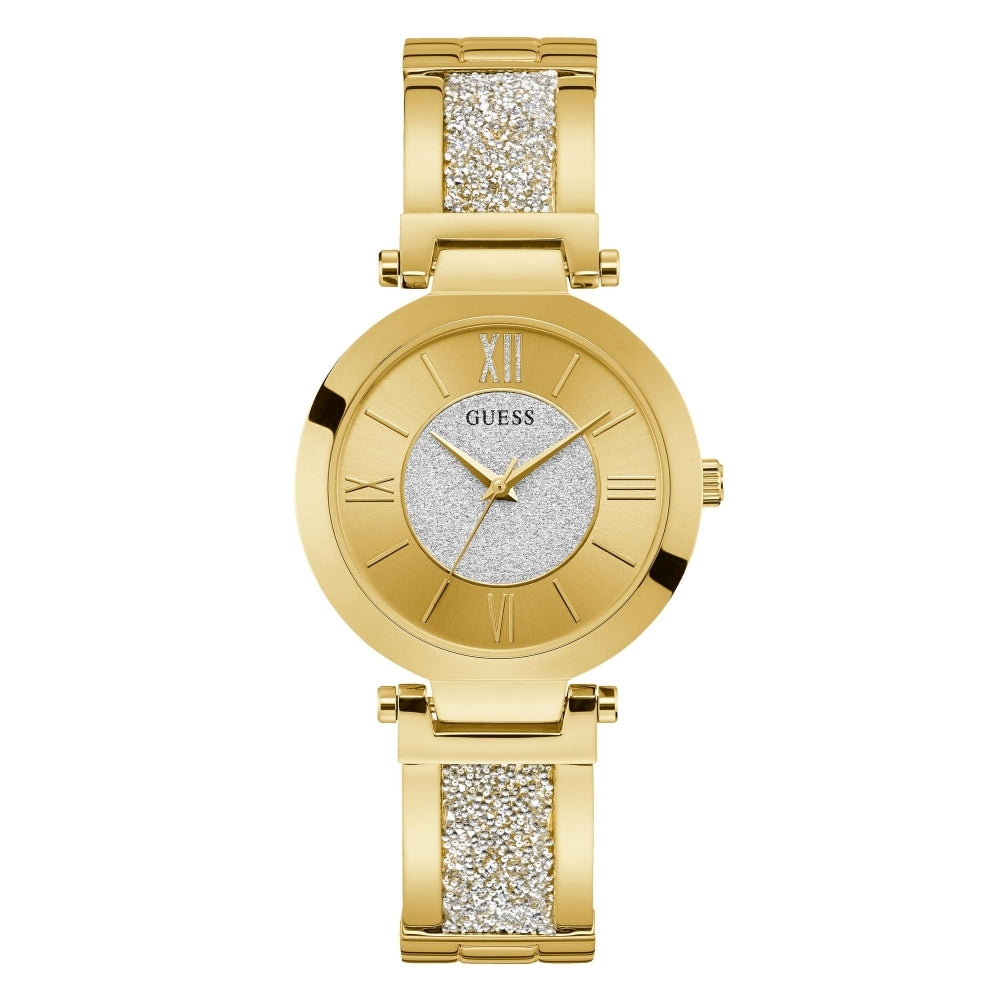 The Guess W1288L2 Women's Aurora Gold Tone Watch features a round face with Roman numerals, a glittery silver center, and a gold band accented by sparkling Swarovski crystals.