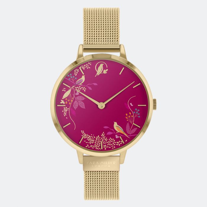 The Sara Miller Pink Birds SA4010 is a watch with a gold mesh strap and a magenta face, adorned with elegant gold floral patterns and charming bird illustrations.