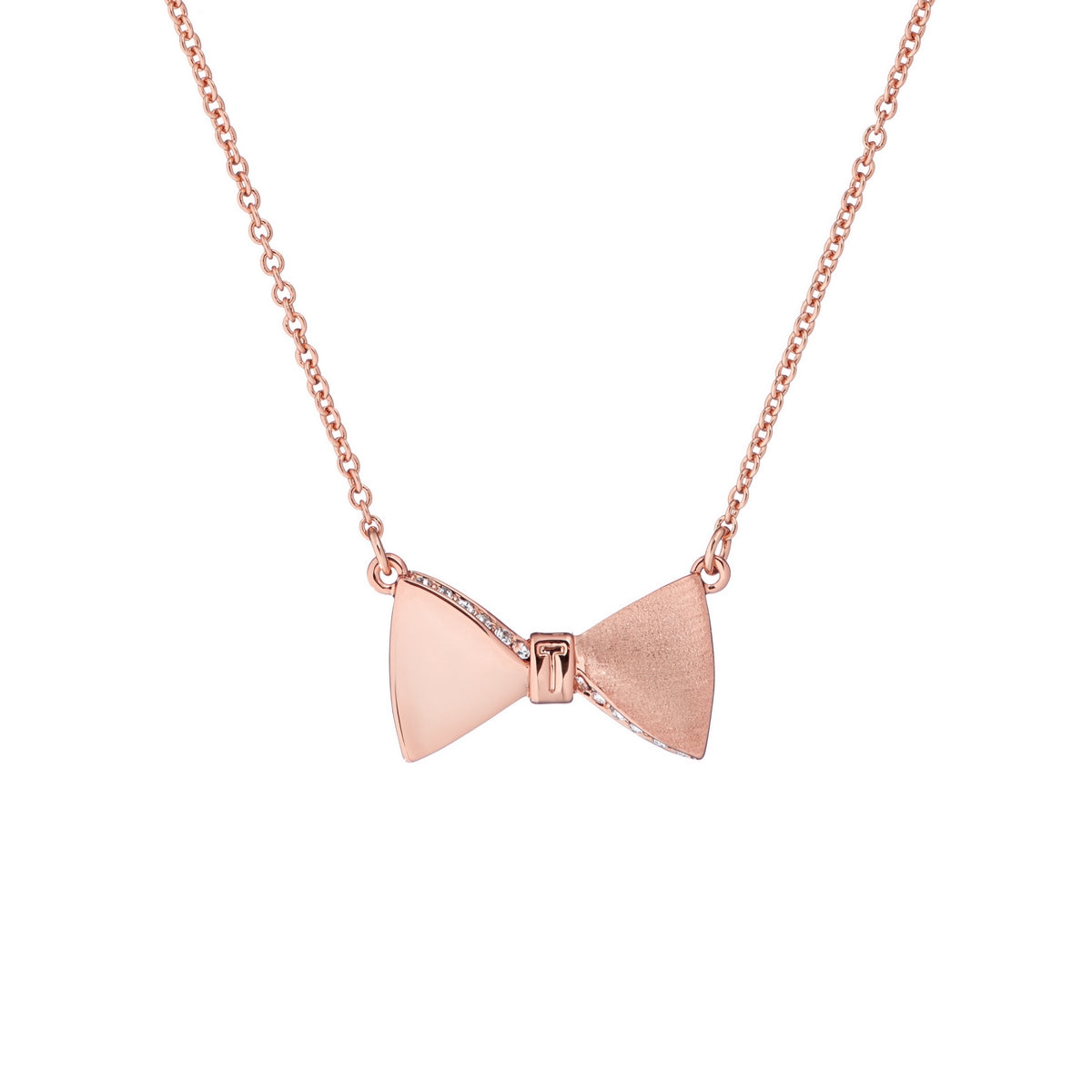 The TED BAKER Tessla Swarovski Crystal Tux Bow Pendant Necklace (TBJ2017-24-02) features a rose gold tux bow pendant with polished and brushed finishes, adorned with a sparkling Swarovski crystal on a fine chain.