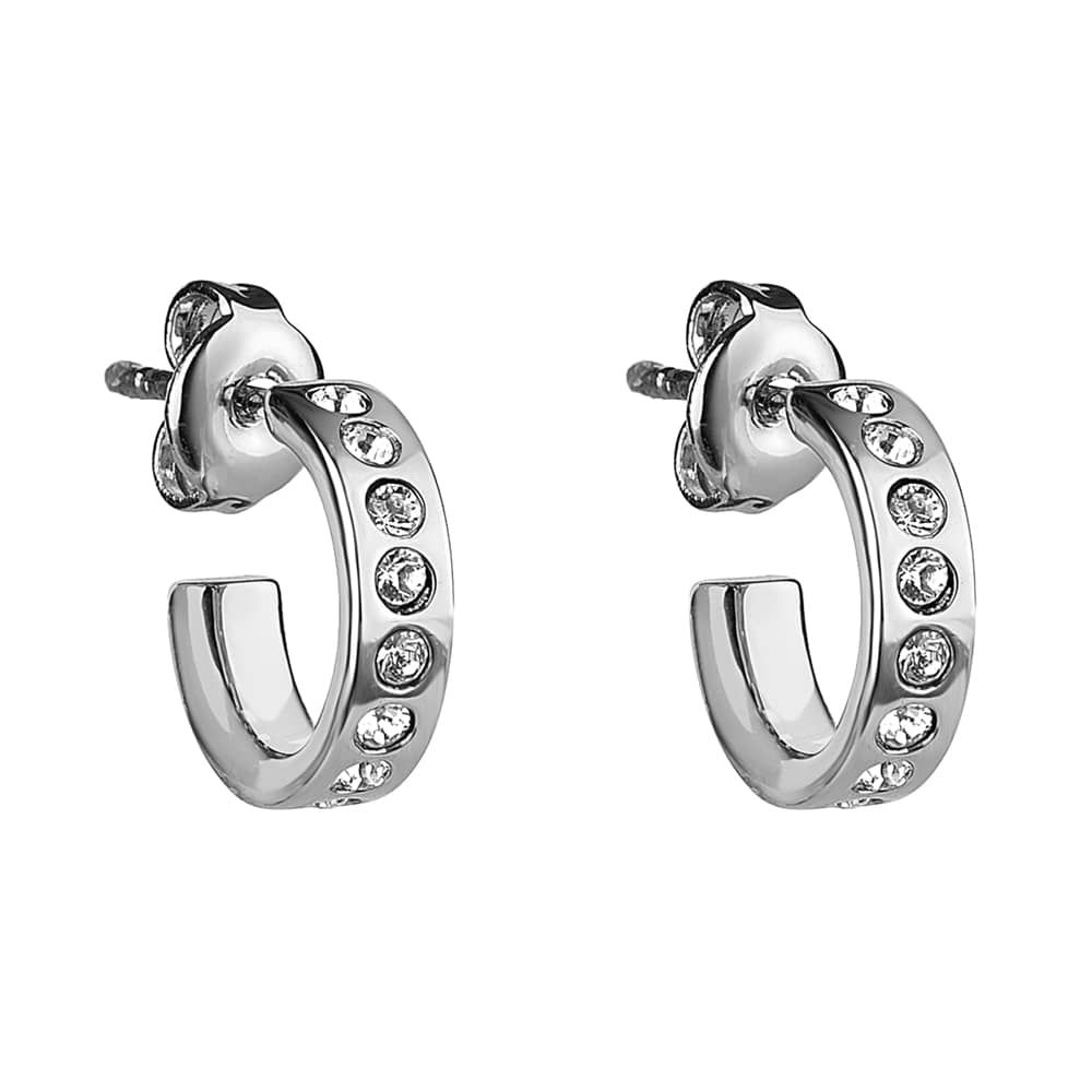 The Ted Baker Seeni Silver Finish Huggie Earrings (TBJ2297-01-02) feature a sleek silver design with sparkling Swarovski crystals, pictured on a white background.